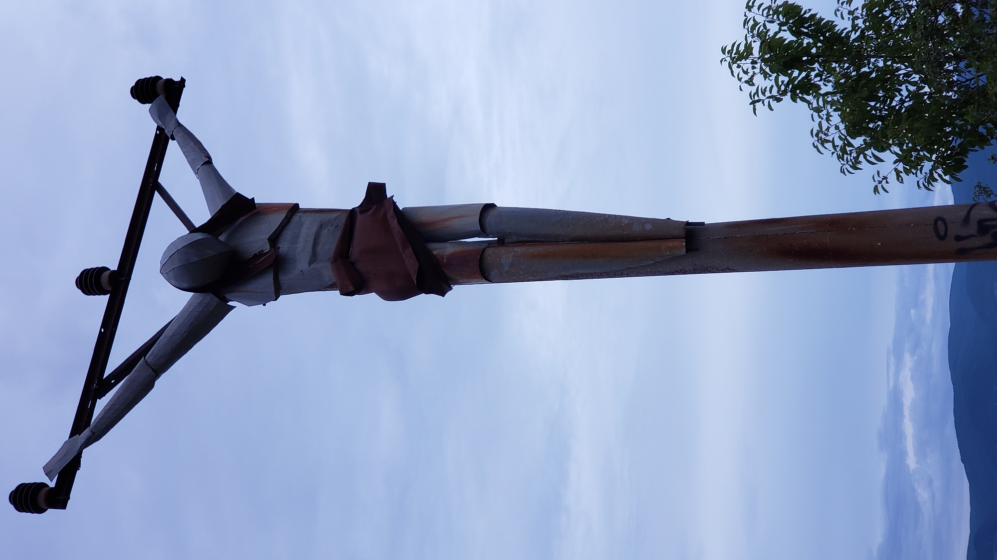 Hilltop views over Prešov at dusk, sculpture included