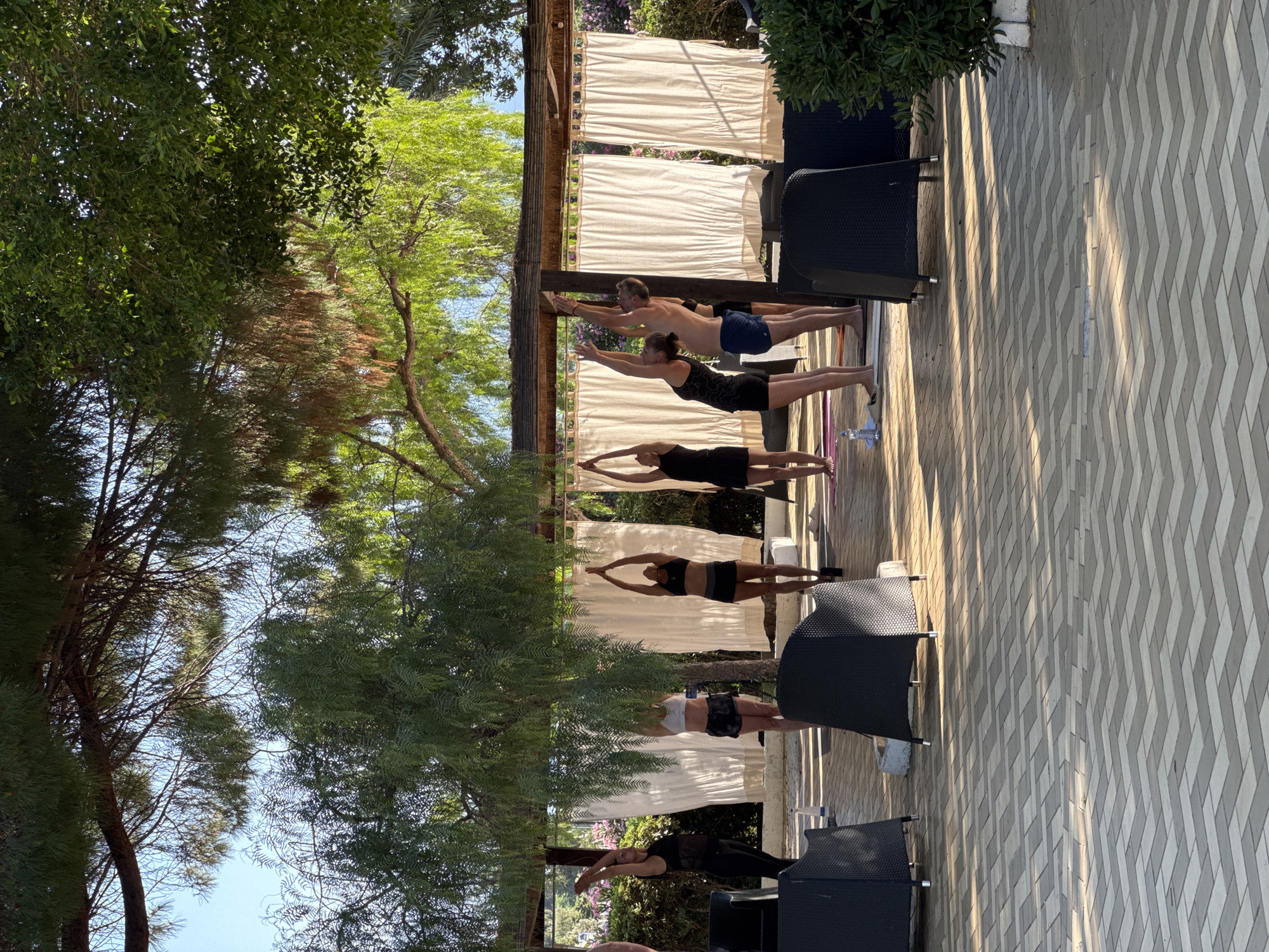 Yoga, stage programming, and poolside evening at Isola delle Femmine resort