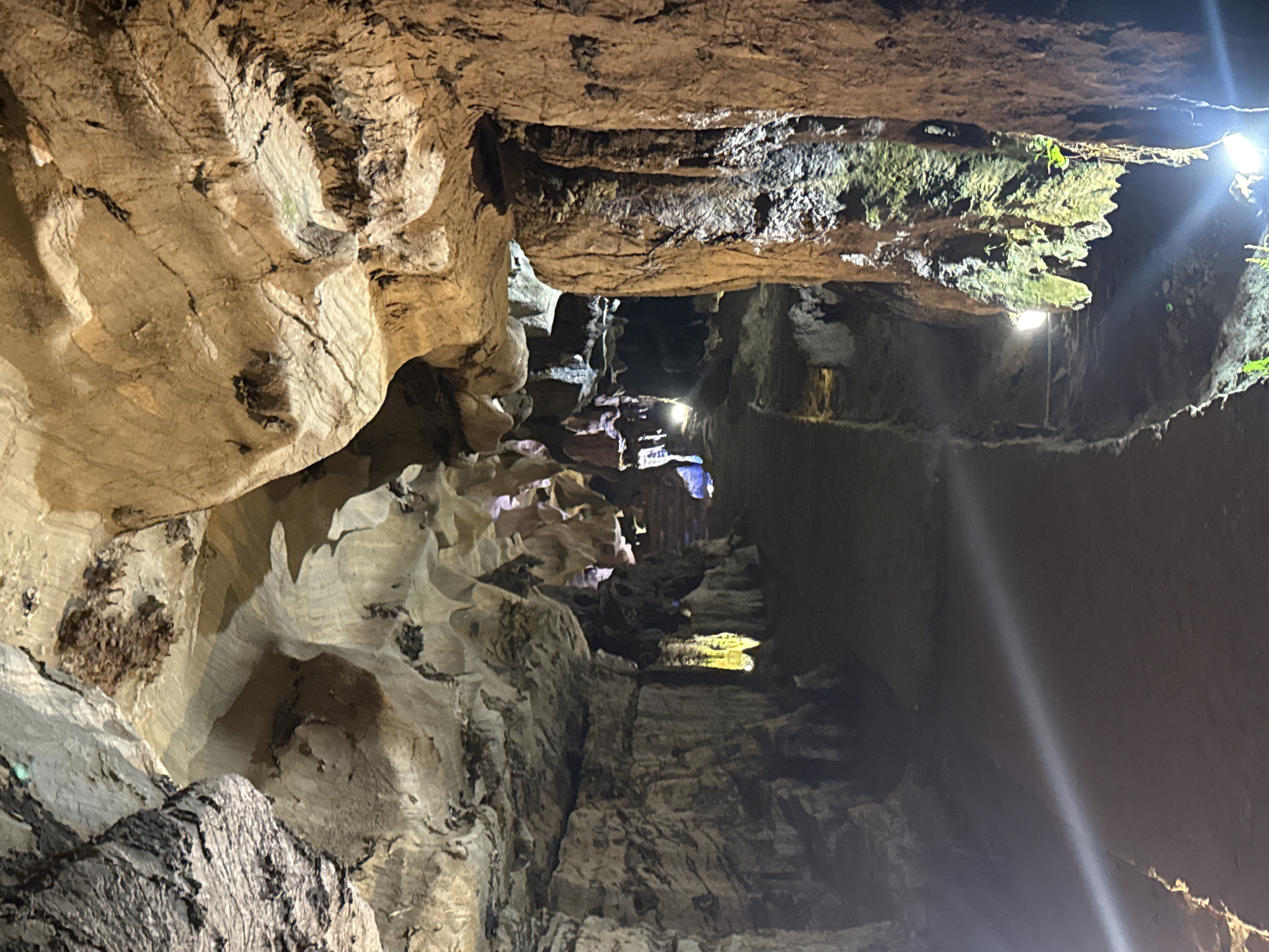 Underground cave system illuminated with artificial lighting and walkways documented