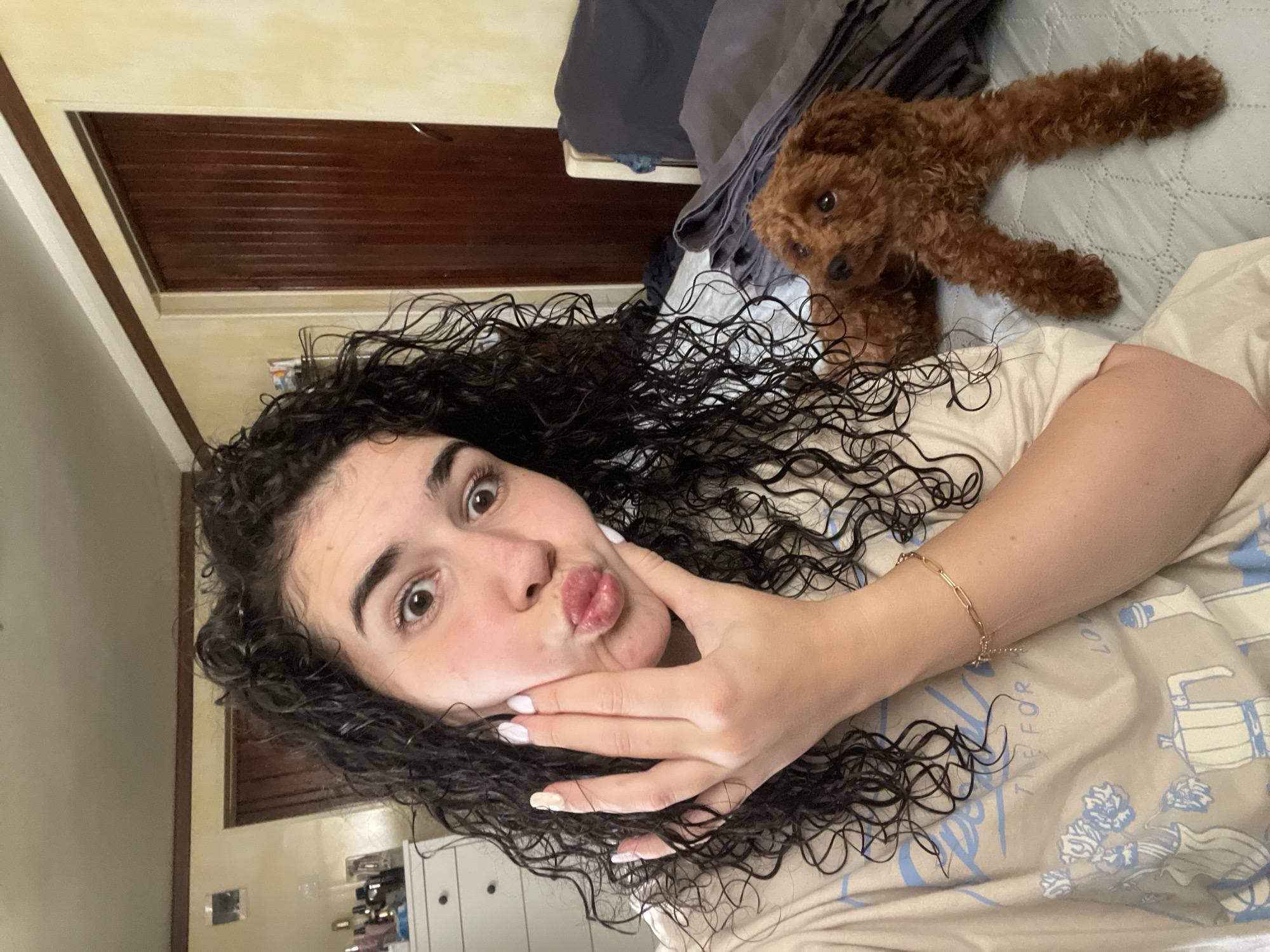 Woman and curly-haired dog share afternoon moments in Sofia