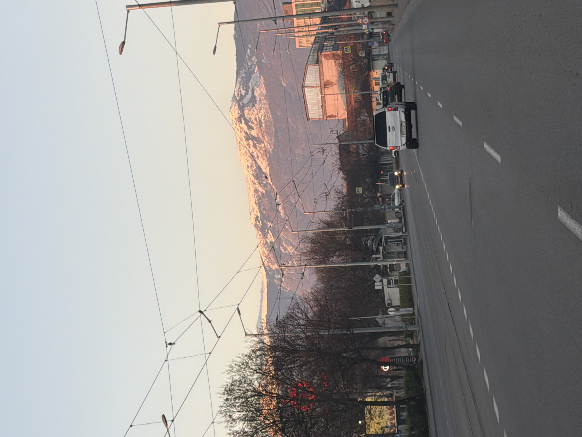 Morning street scene documented in Sofia with mountain backdrop