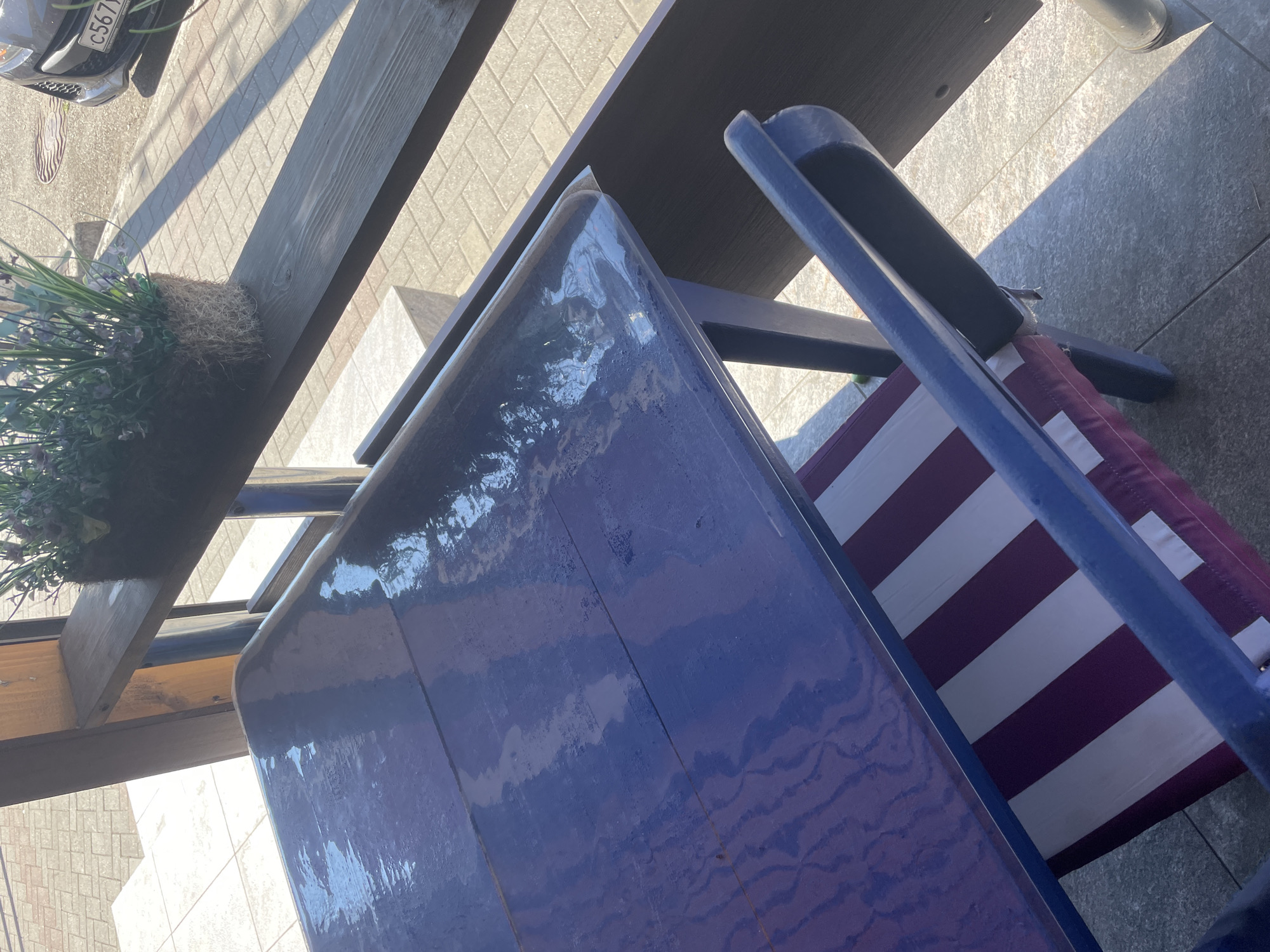 Outdoor furniture and a brick BBQ pit up close