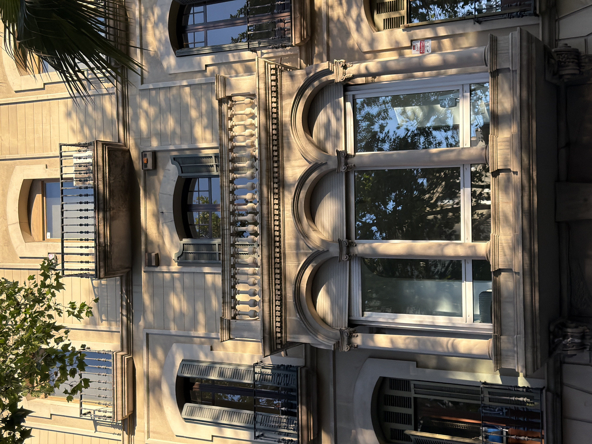 Barcelona's ornate building facades in warm evening light
