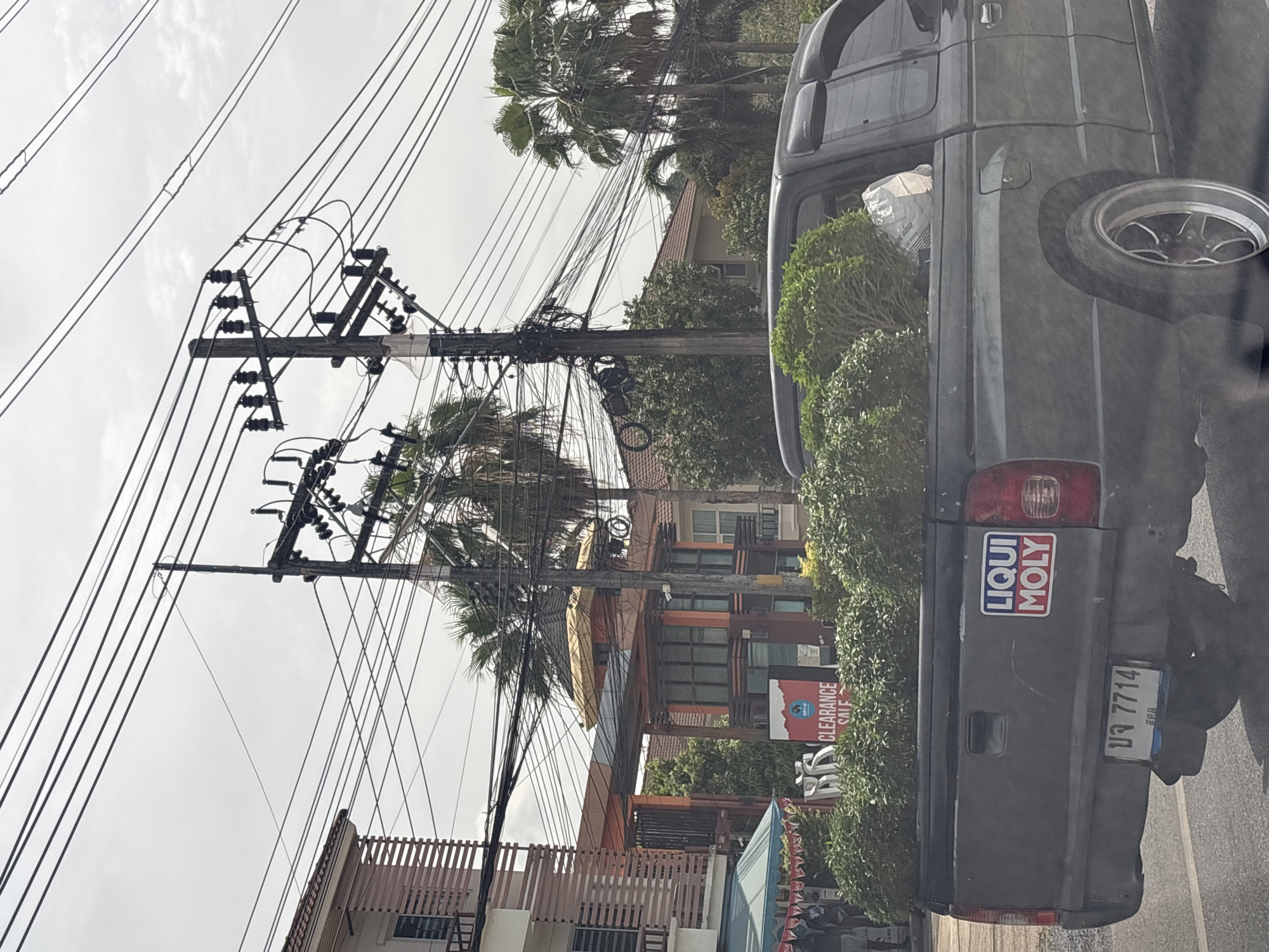 Street scene captured in Si Sunthon showing electrical infrastructure