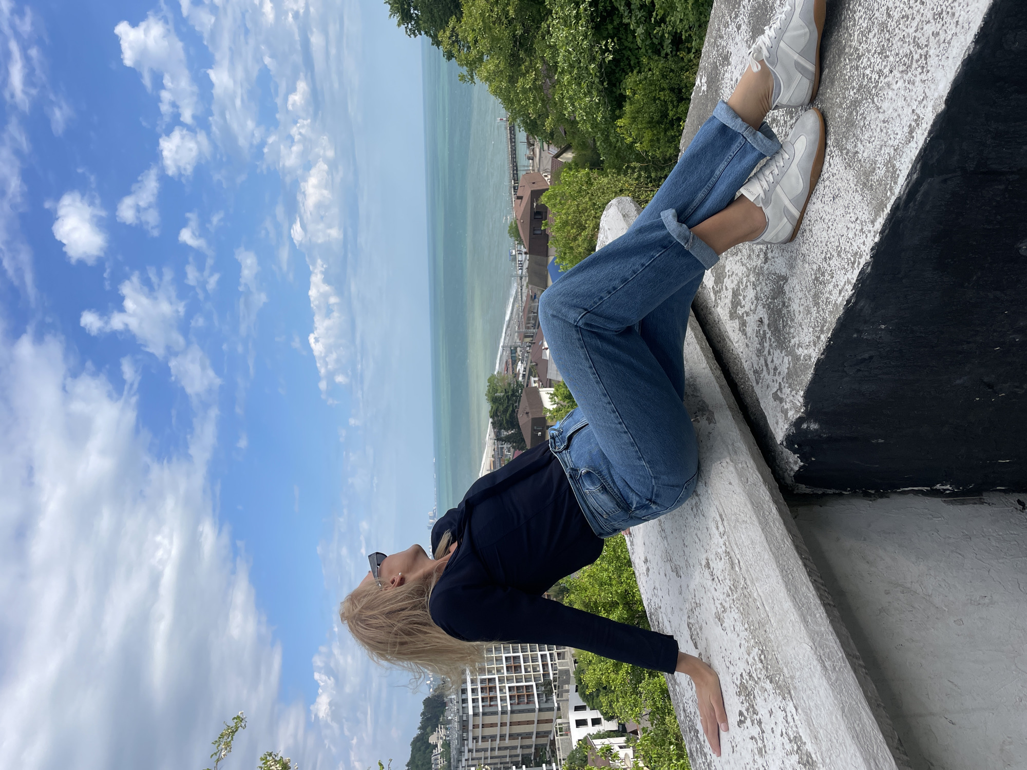 Woman enjoys scenic moment on Dagomys overlook