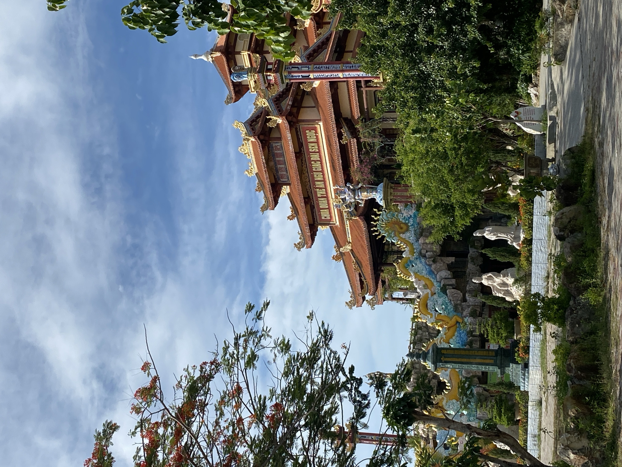 Morning at a Da Nang Buddhist temple complex with lotus ponds