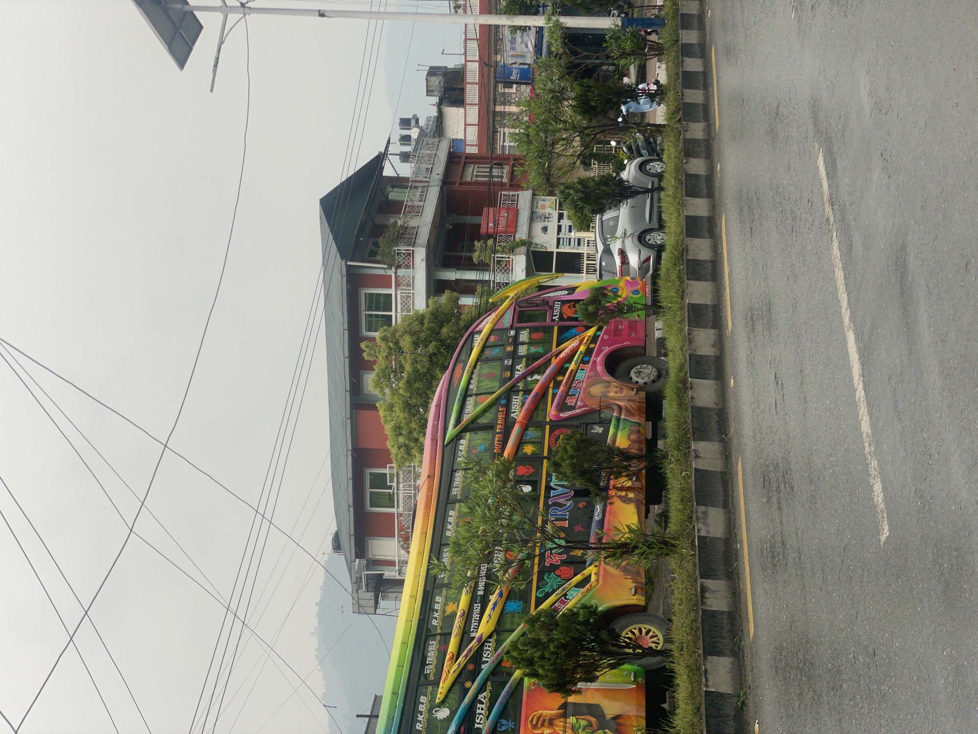 Colorful buses spotted on wet Pokhara streets after rain