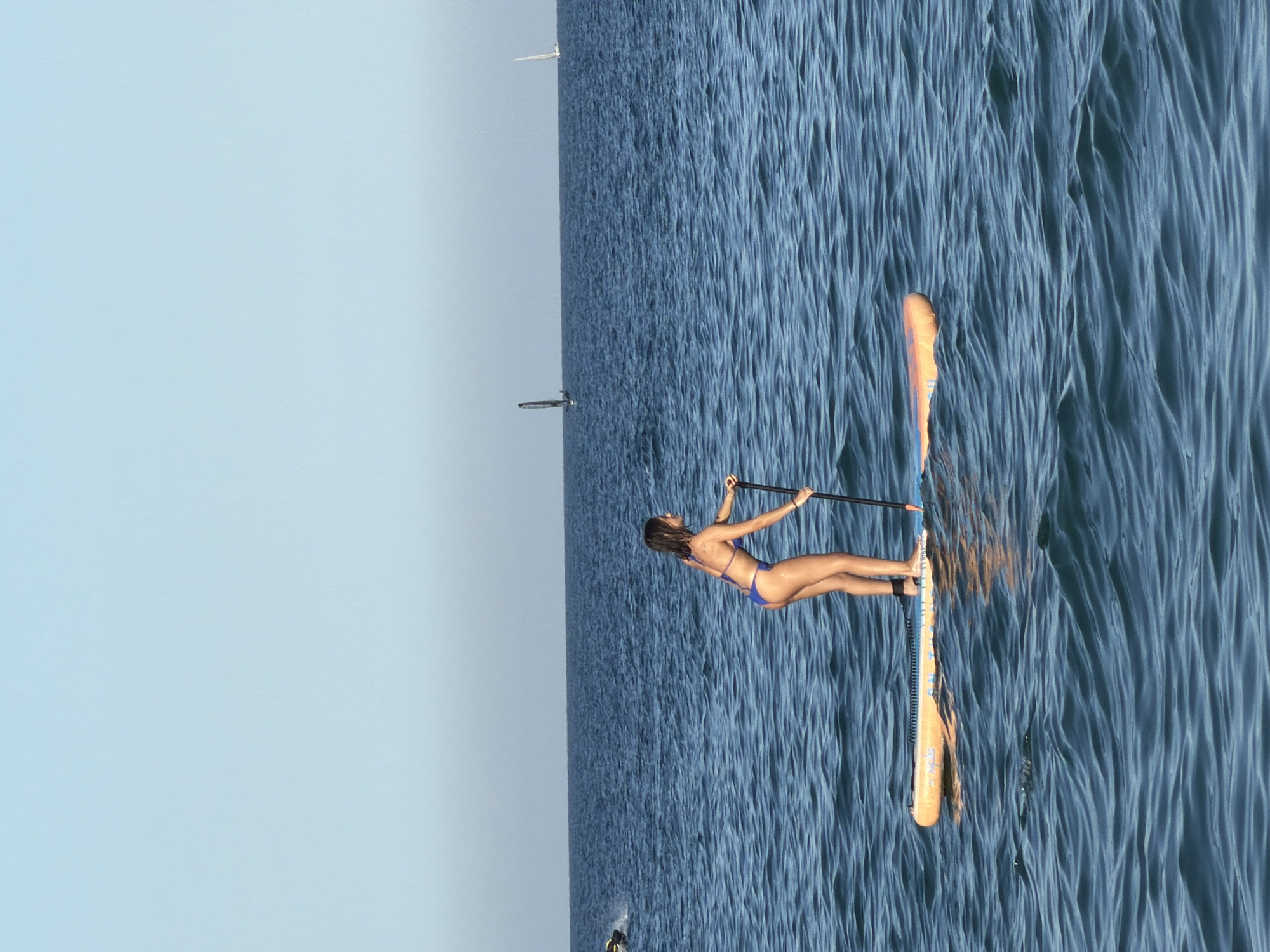 Summer day unfolds at Barcelona's Barceloneta Beach with Elvis performer