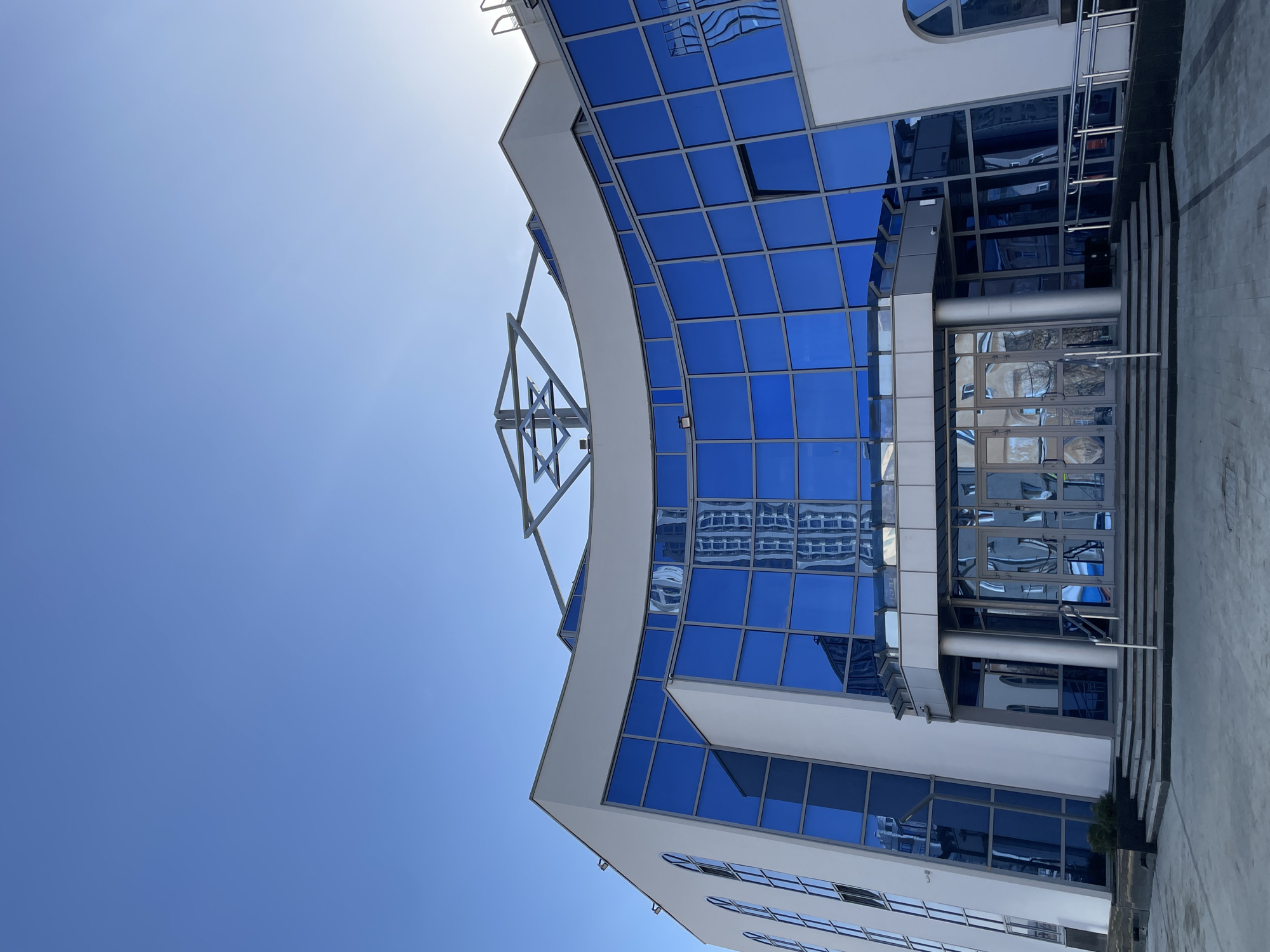 Modern curved glass building exterior photographed in Yekaterinburg