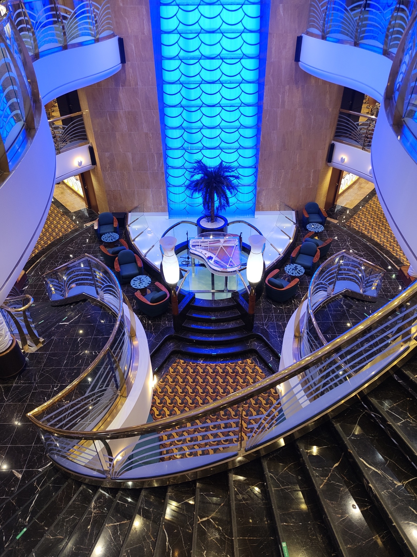 Transparent grand piano observed in luxury interior atrium