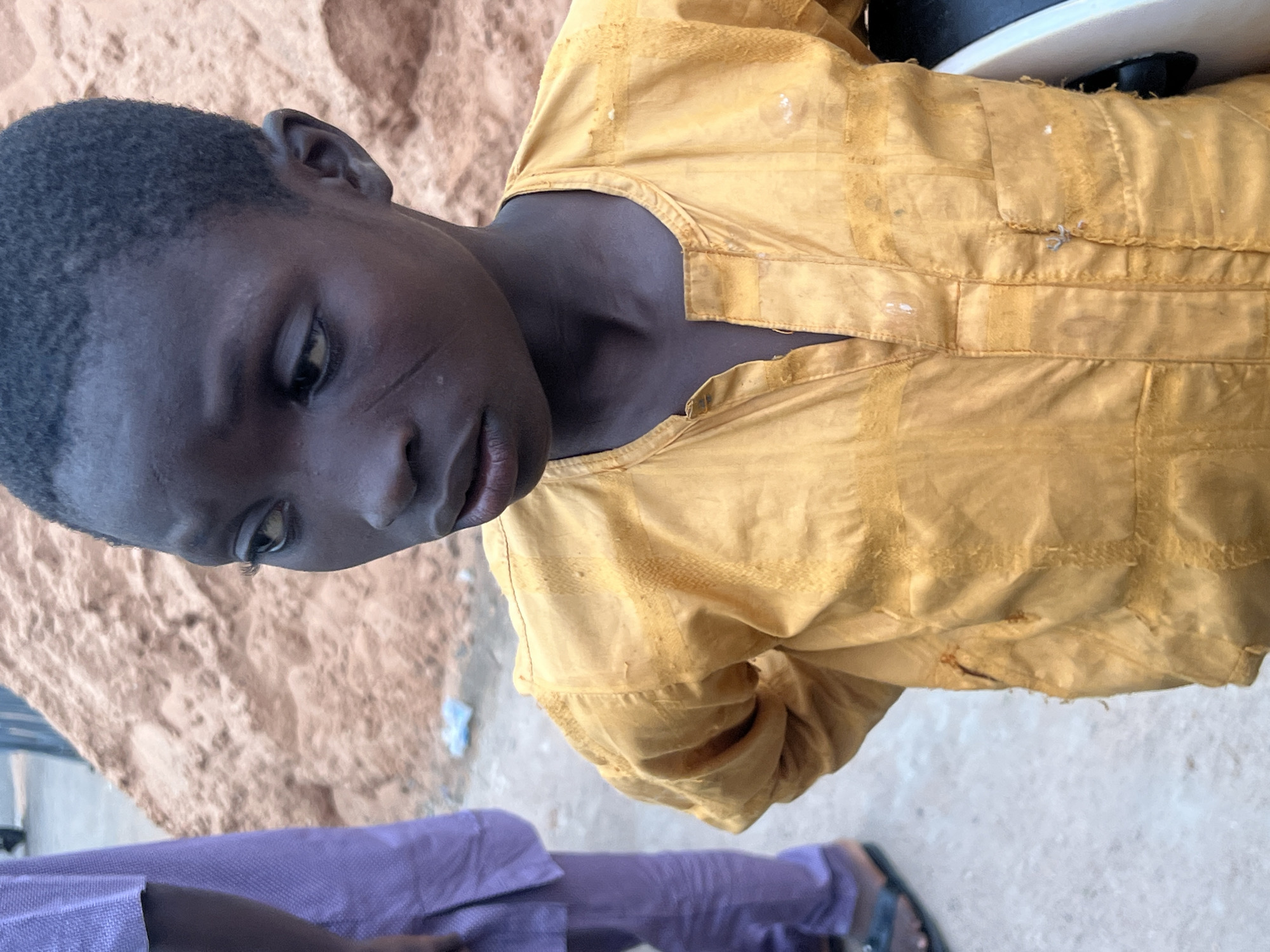 Street life and commerce across a busy Gombe corridor