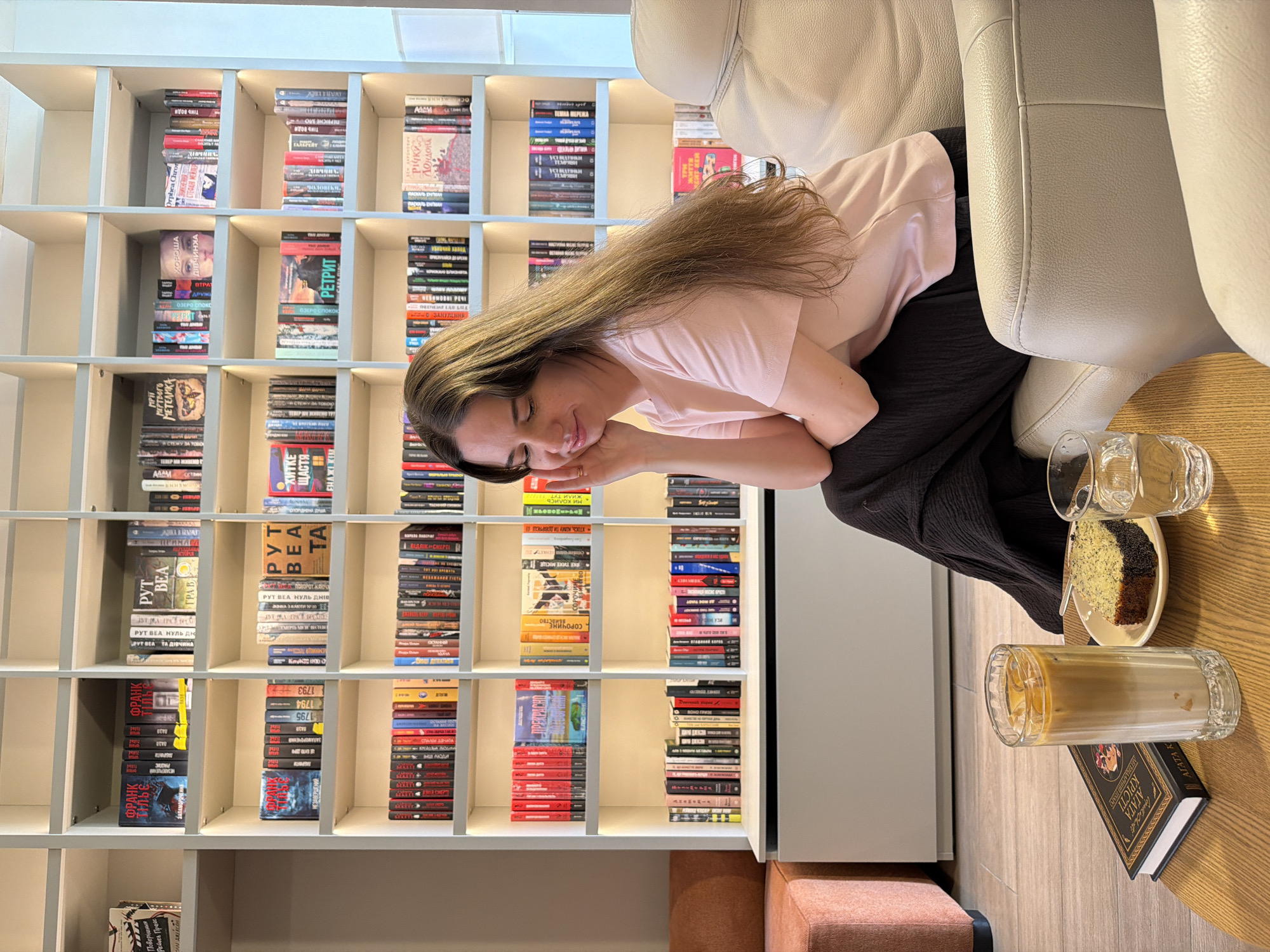 Morning at a Kyiv book cafe, cake and shelves included