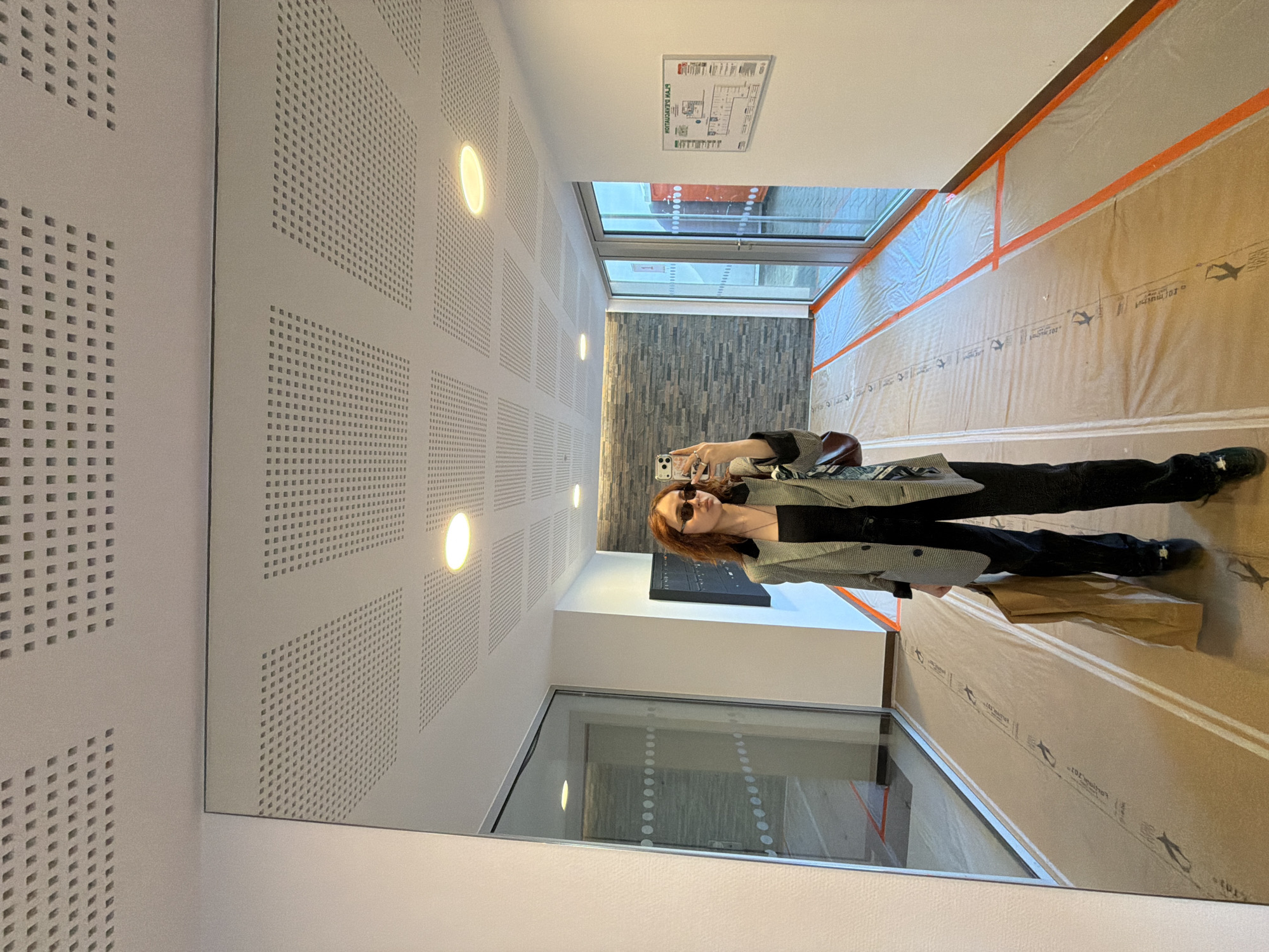 Woman Takes Selfies at Strasbourg Shopping Mall