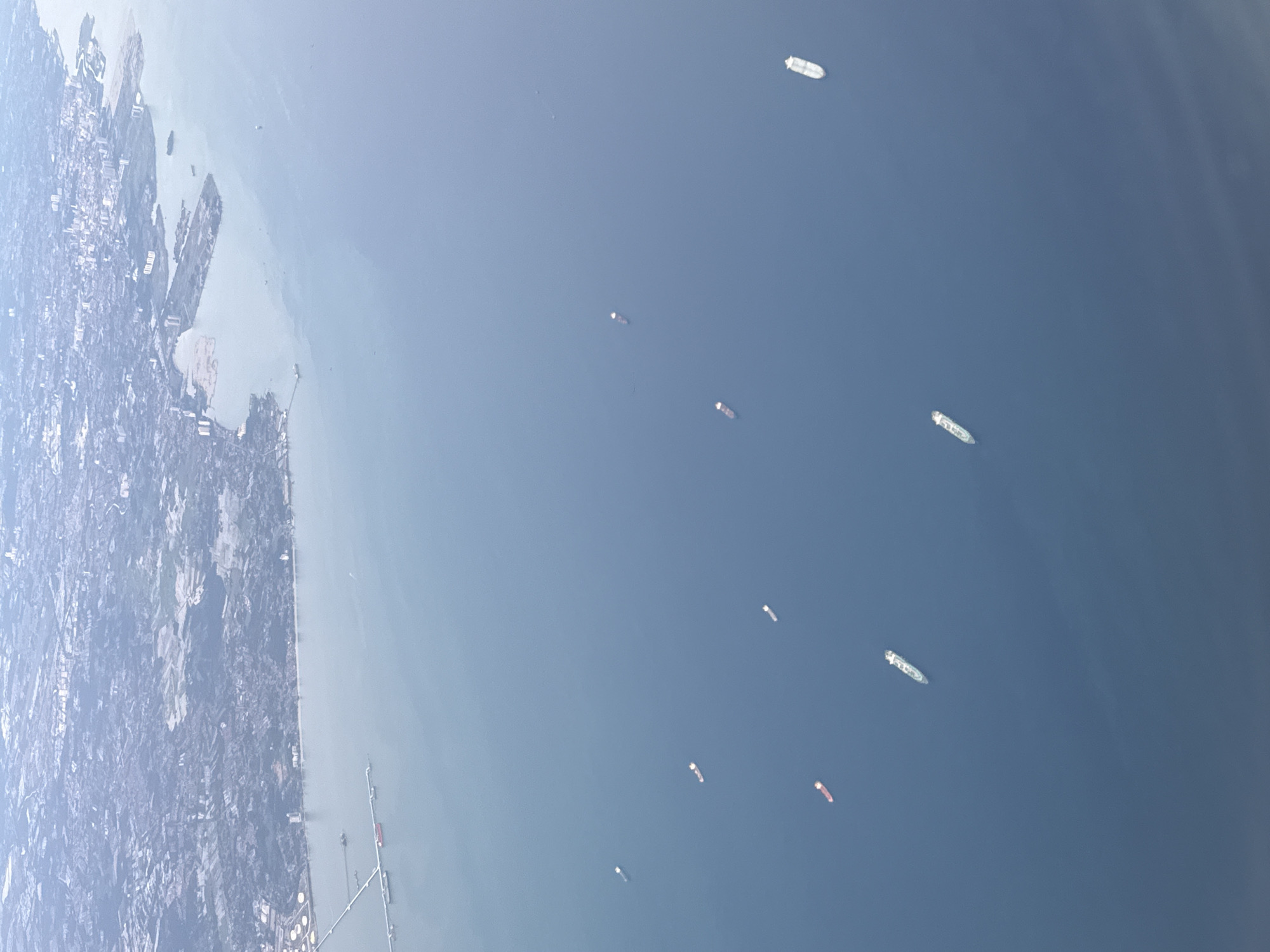Pregnant passenger documents flight experience over Denpasar, Indonesia