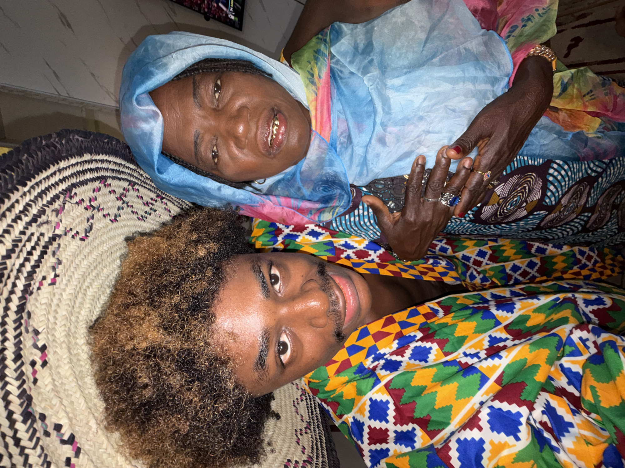 Two people share smiling moment indoors in Igboefon, Nigeria