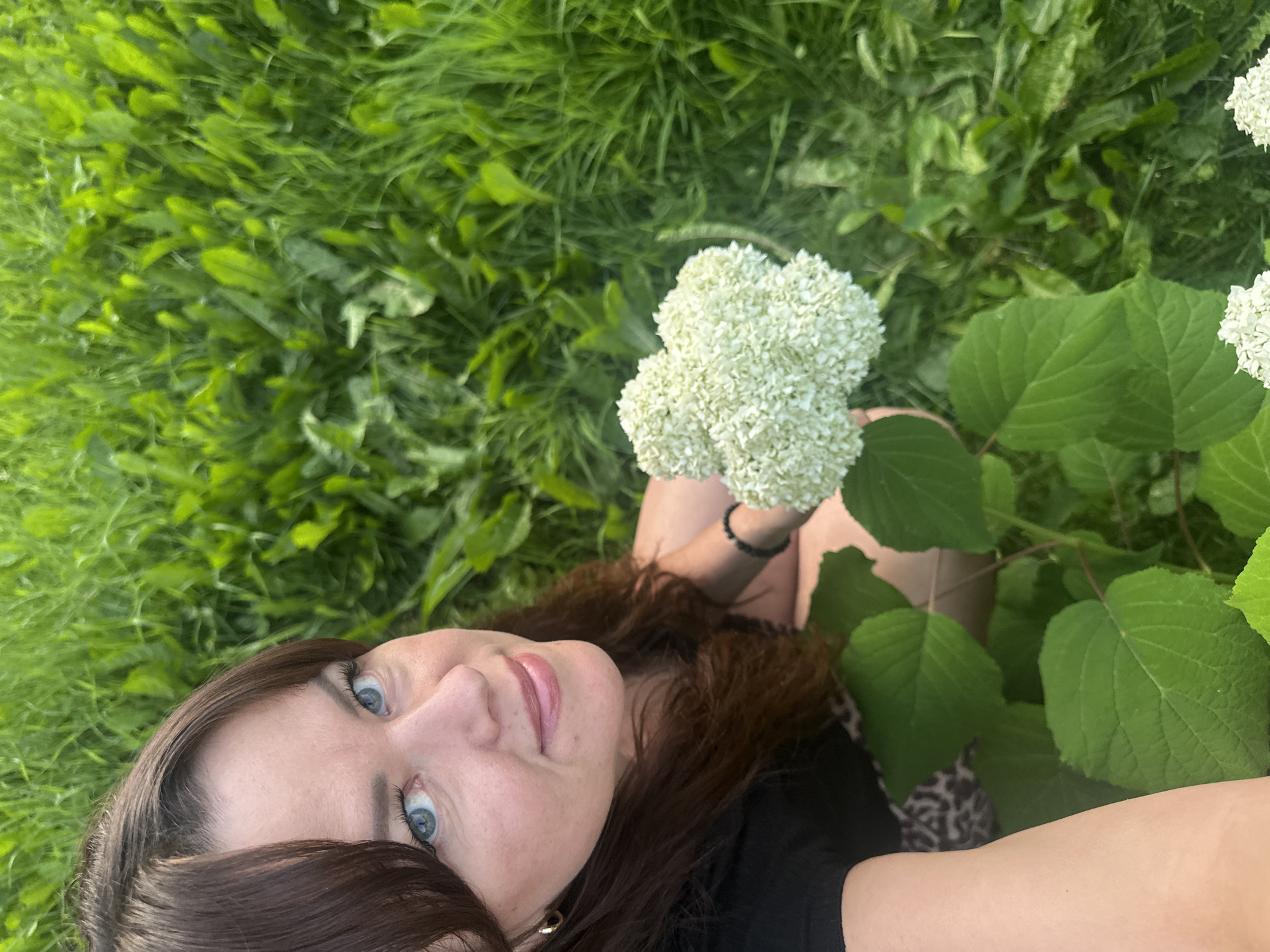 Cutting garden flowers on a summer afternoon in Chaikovsky