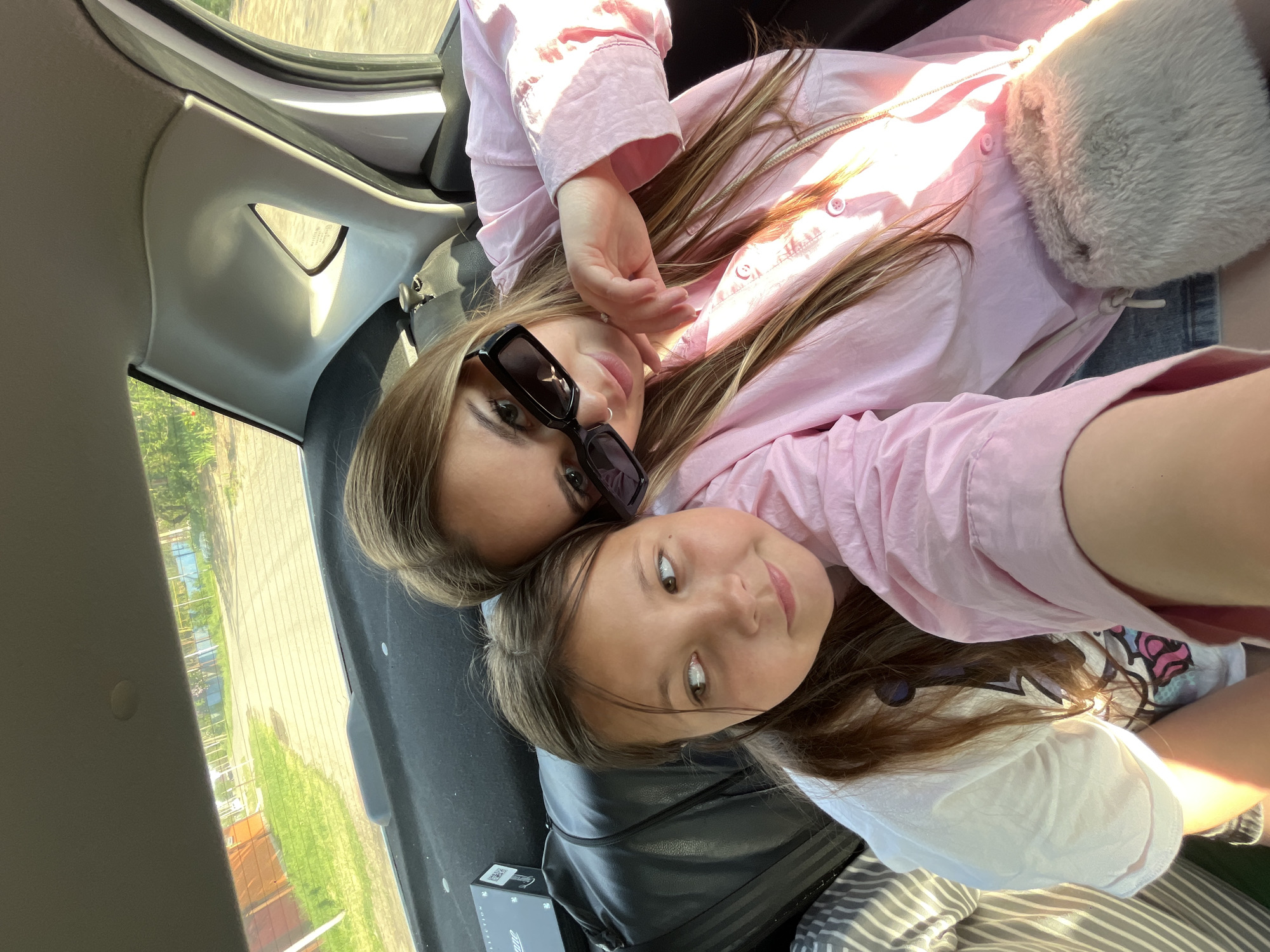 Two females photographed lying in car trunk in Russia