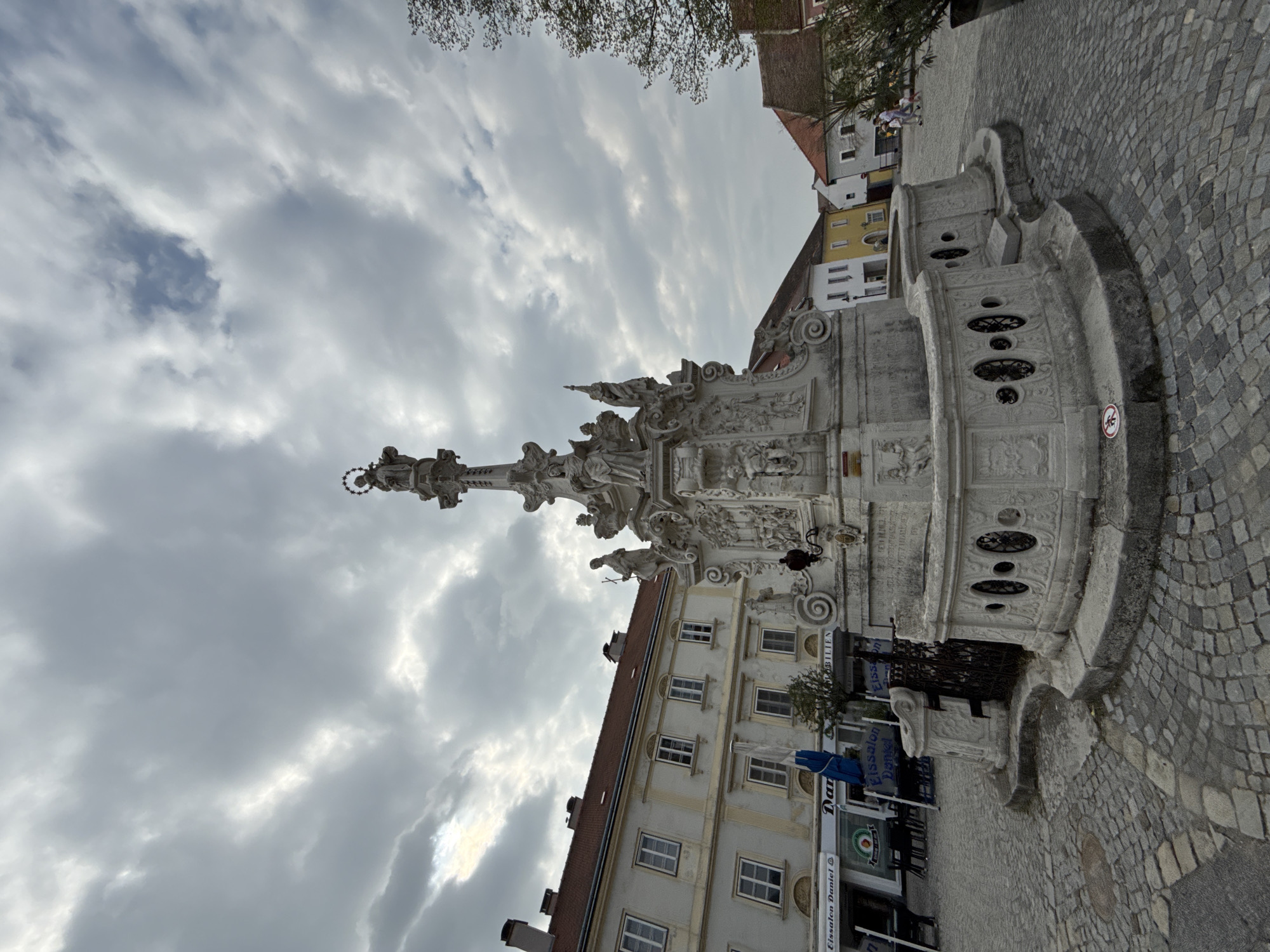 Tourist documents historic Austrian town's architecture and streets