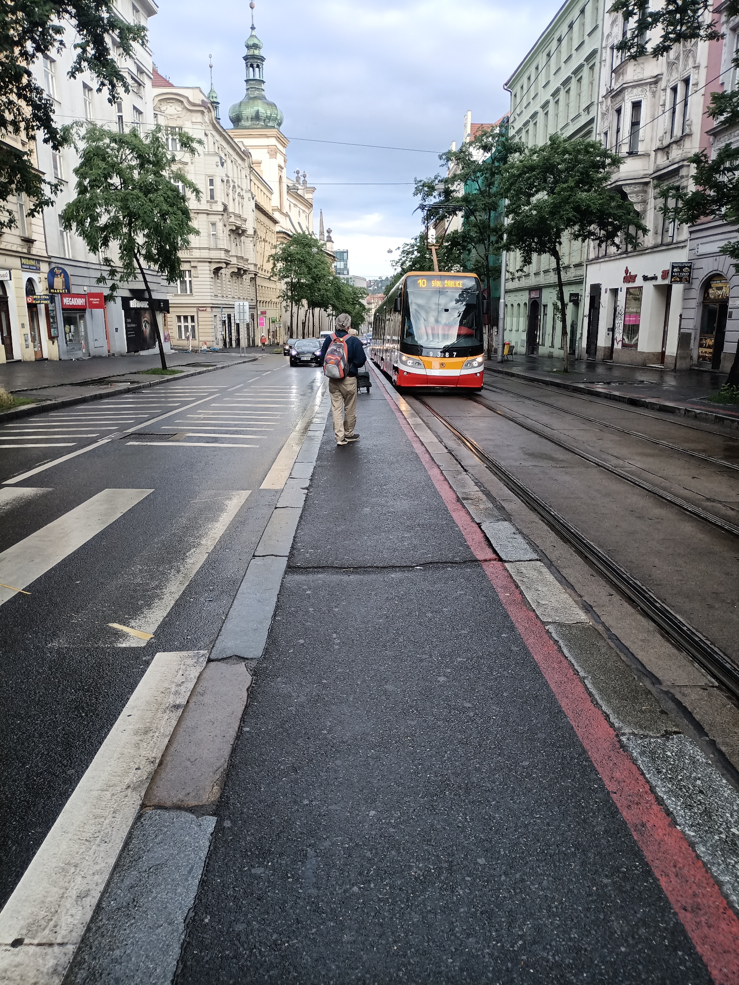 Rainy morning tram ride documented through Prague streets