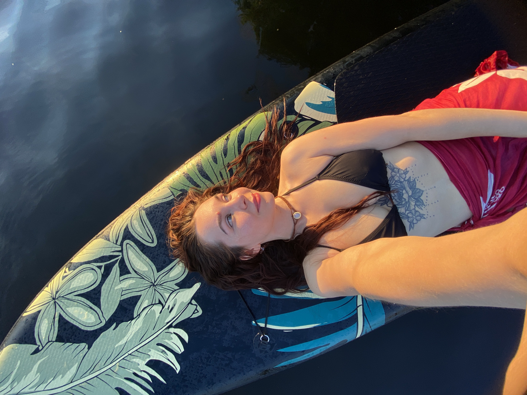 Summer evening on the Kama River, paddleboards and a jet ski