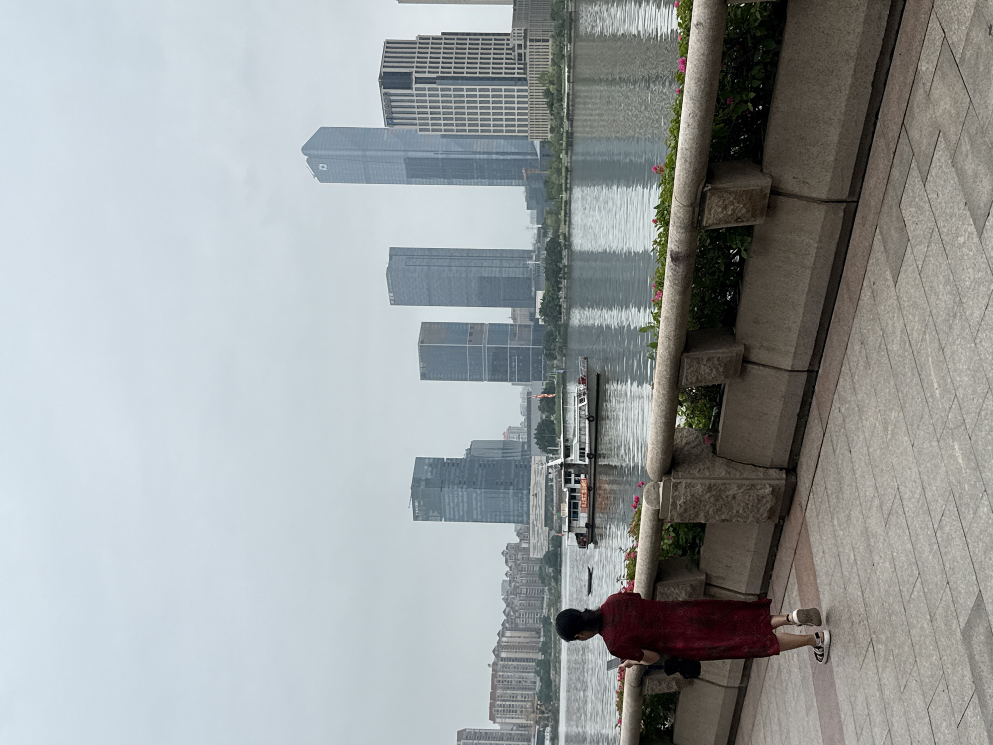 Haizhu riverside promenade with skyline views and river traffic