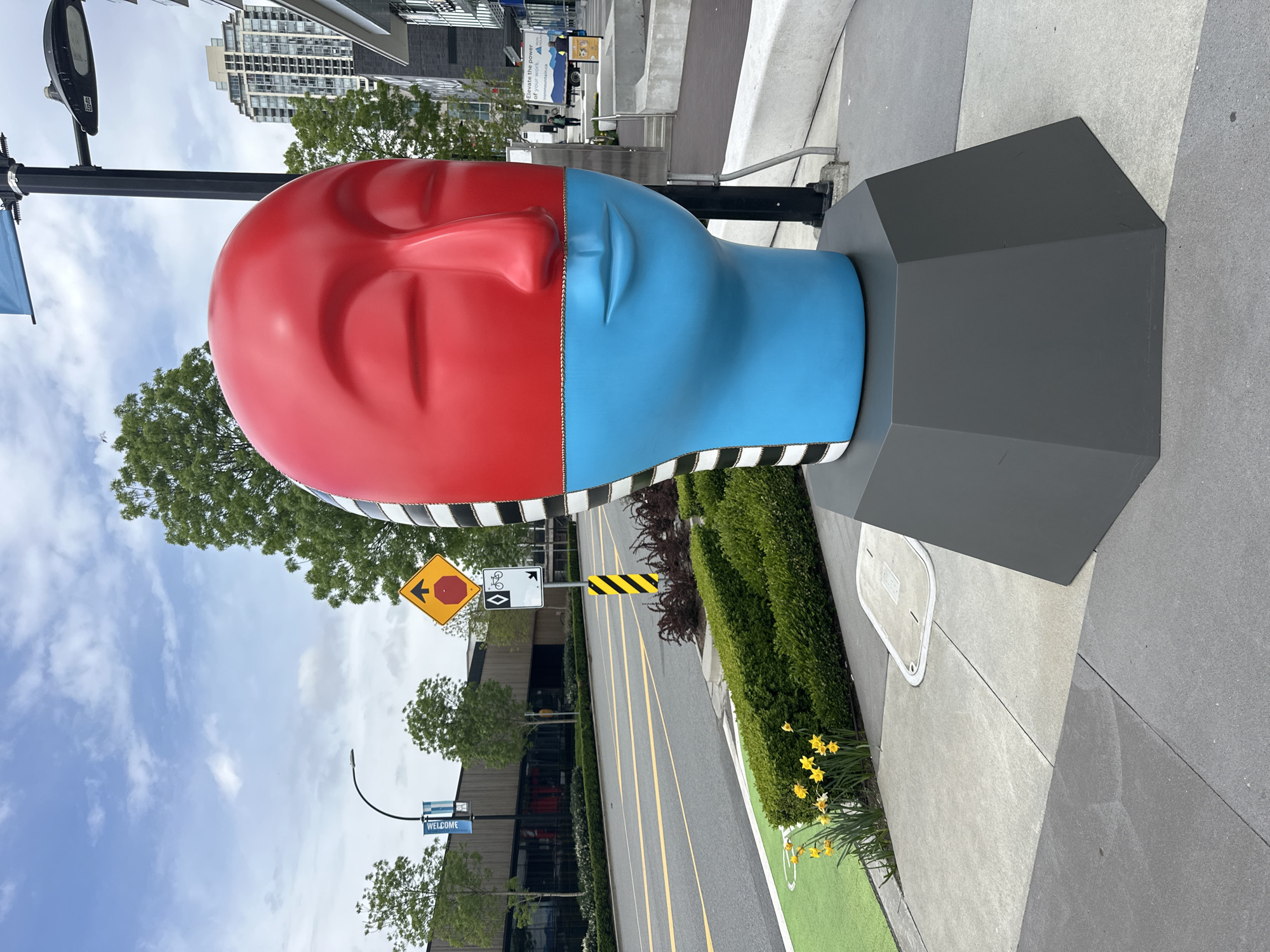 Colorful head sculptures spotted on Burnaby sidewalk