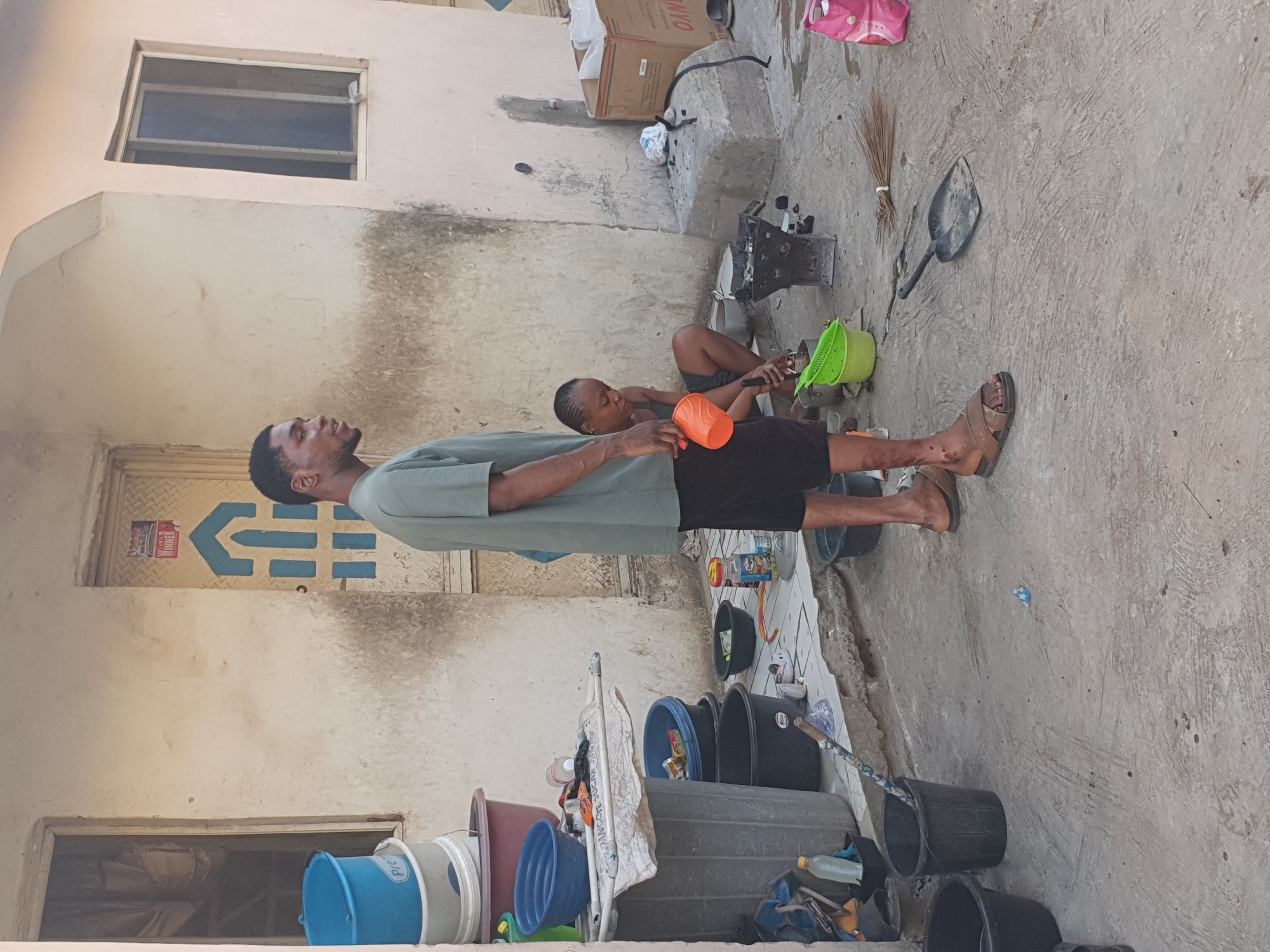 Man and woman work with produce in Lokoja, Nigeria