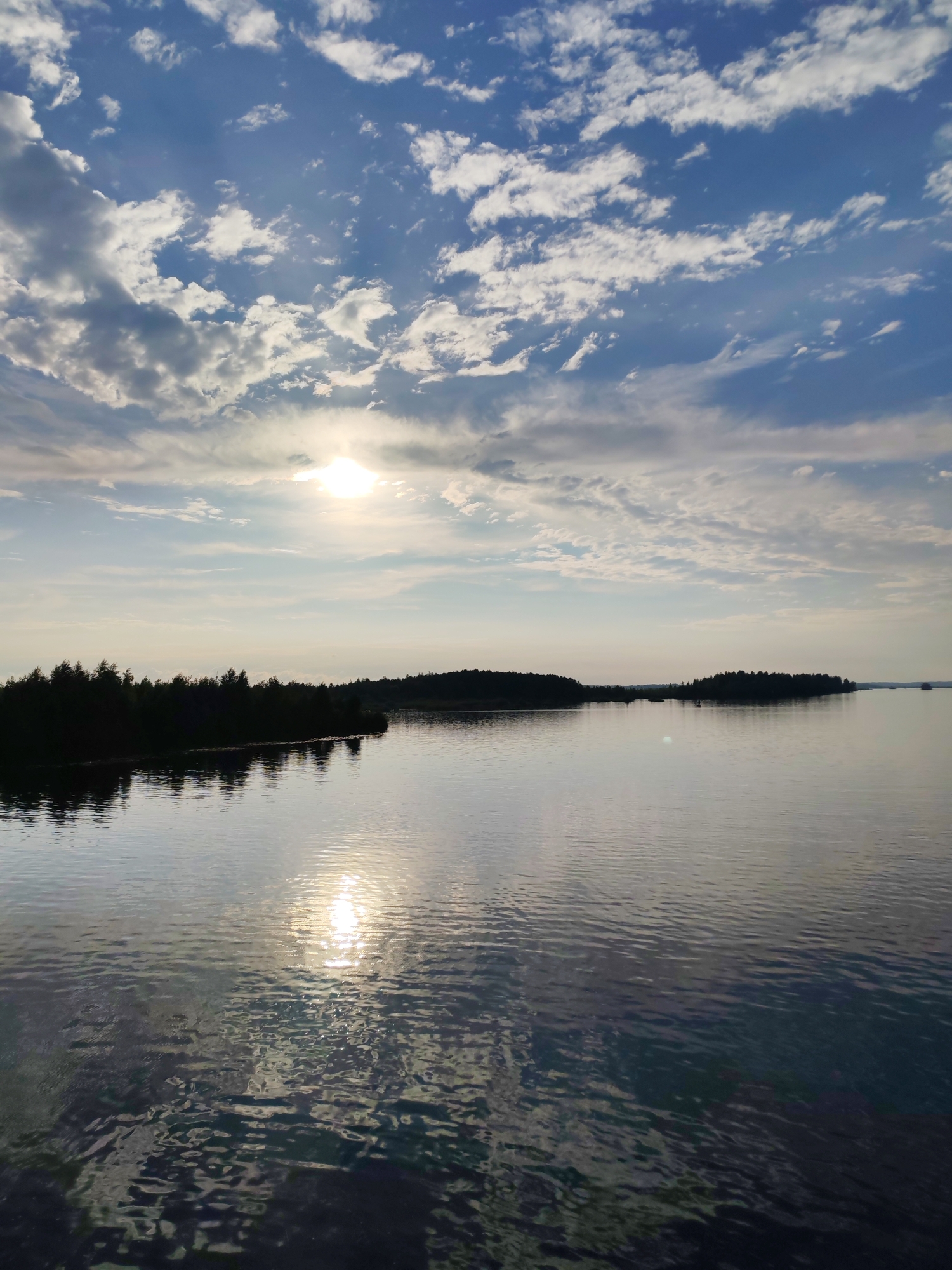 Calm lake under low afternoon sun, Bereg, Russia