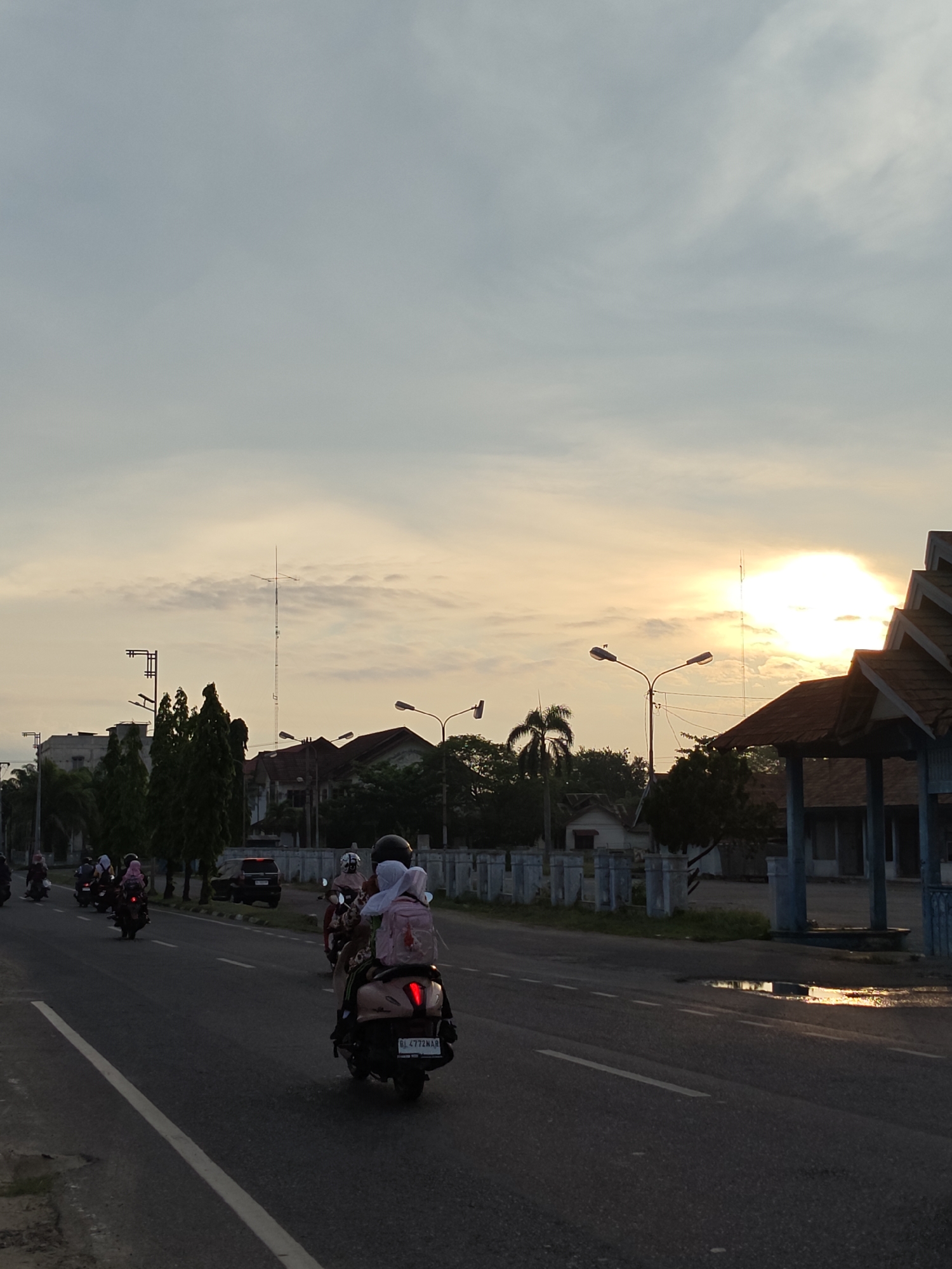Evening traffic flows through Lhokseumawe streets
