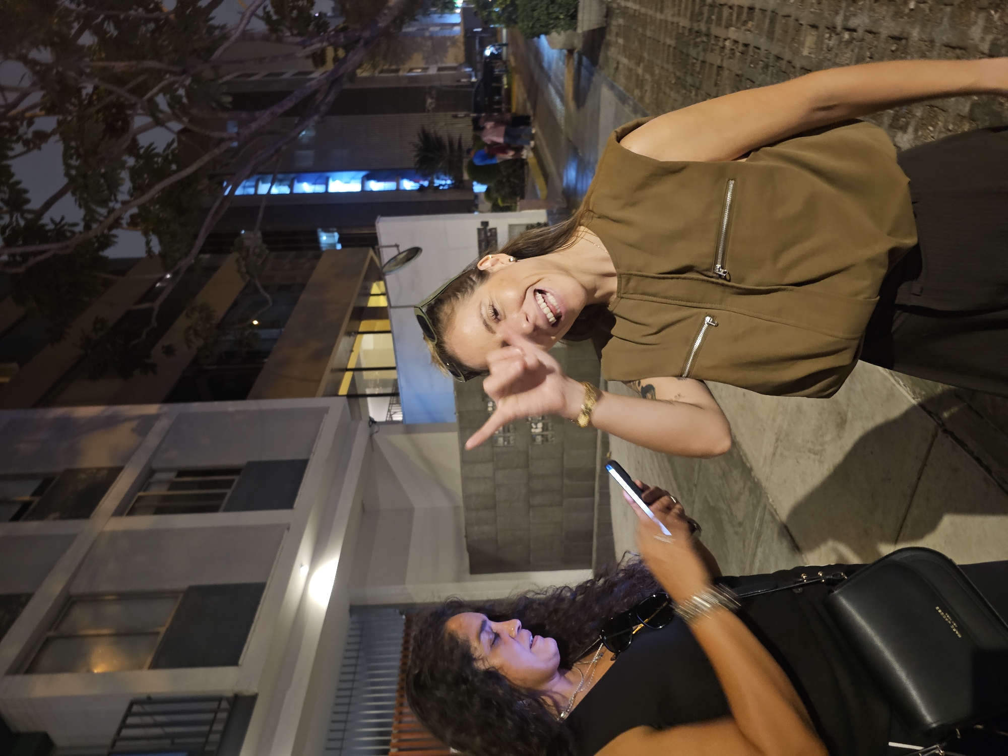 Two women spotted together in nighttime Miraflores, Peru