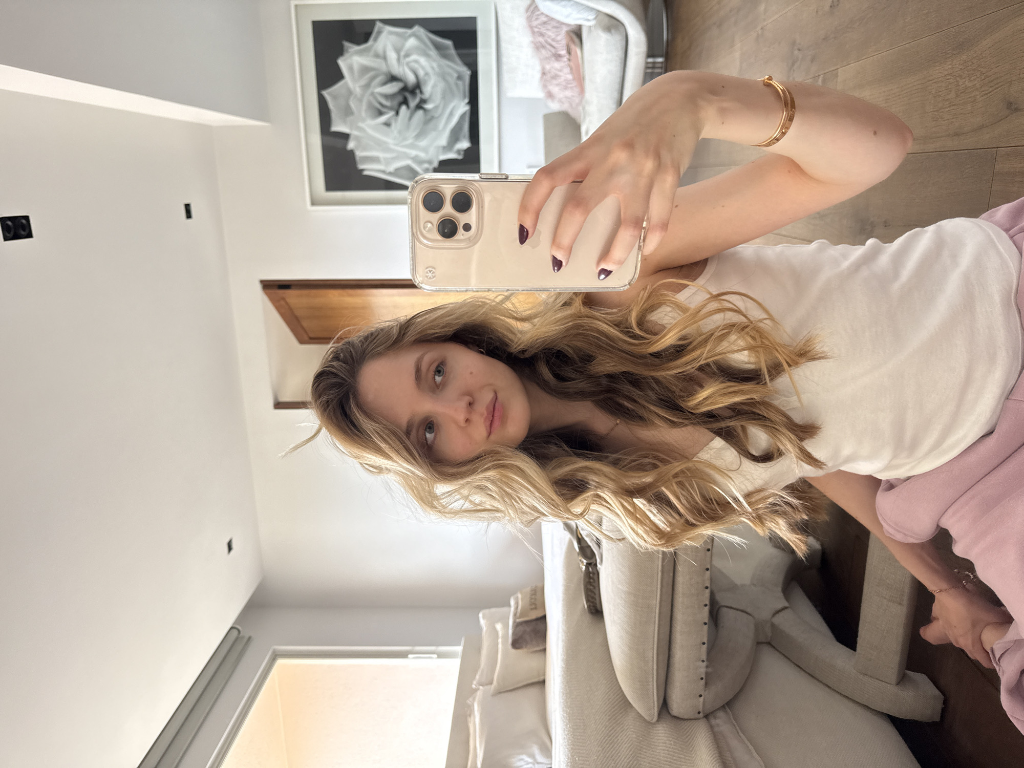 Woman takes selfies in modern Mexico City interior