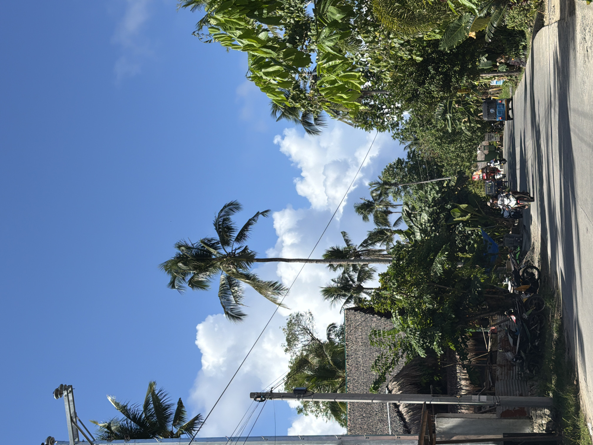 Sunny morning street scene documented in General Luna, Philippines