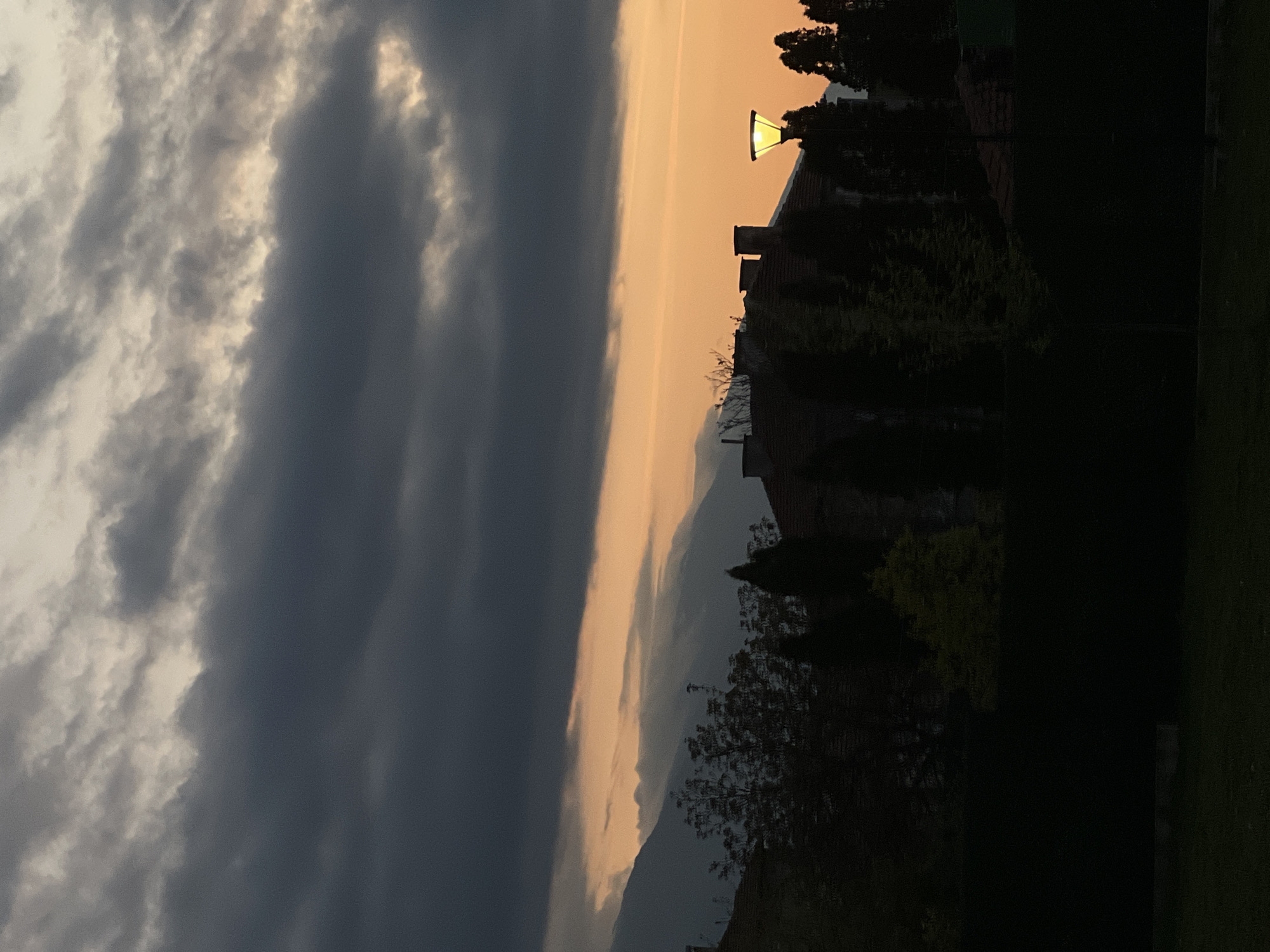 Dusk storm clouds and orange sky observed in Petrich