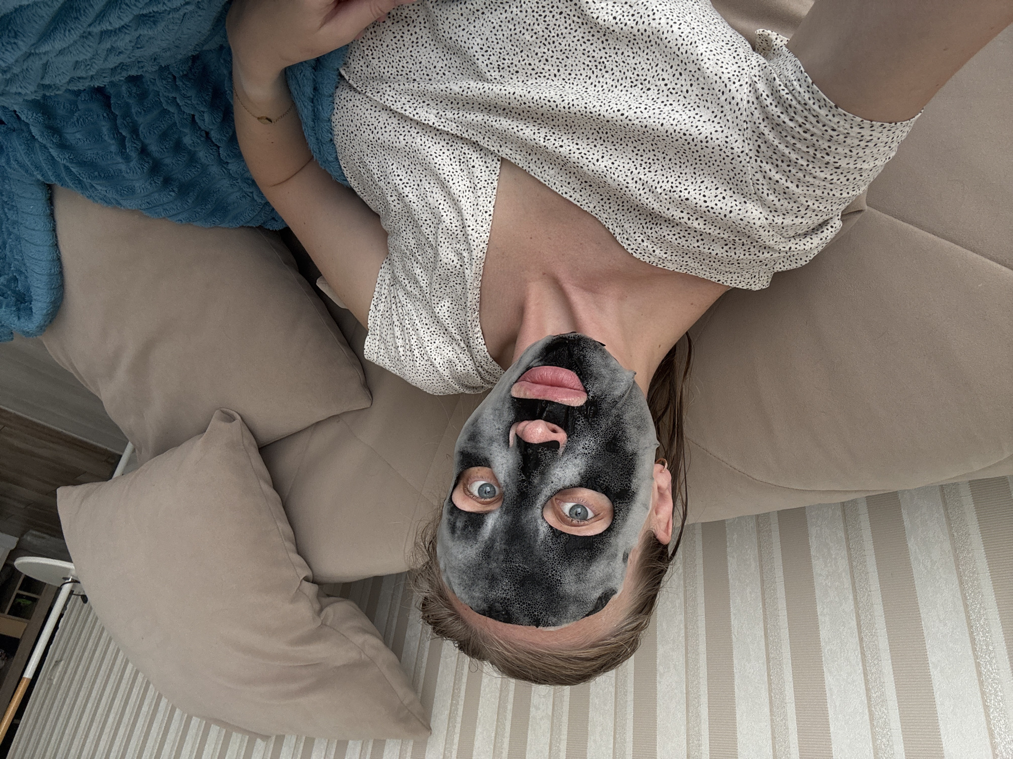 Woman takes selfies while wearing facial mask in Sirius