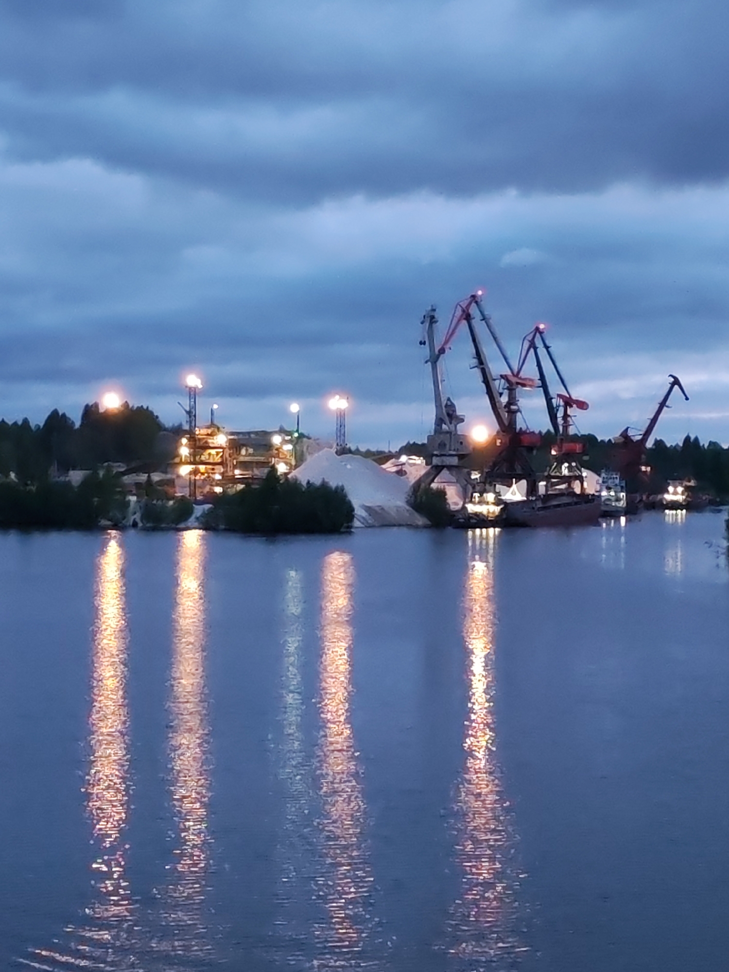 Russian industrial waterfronts observed at dusk with reflected lights