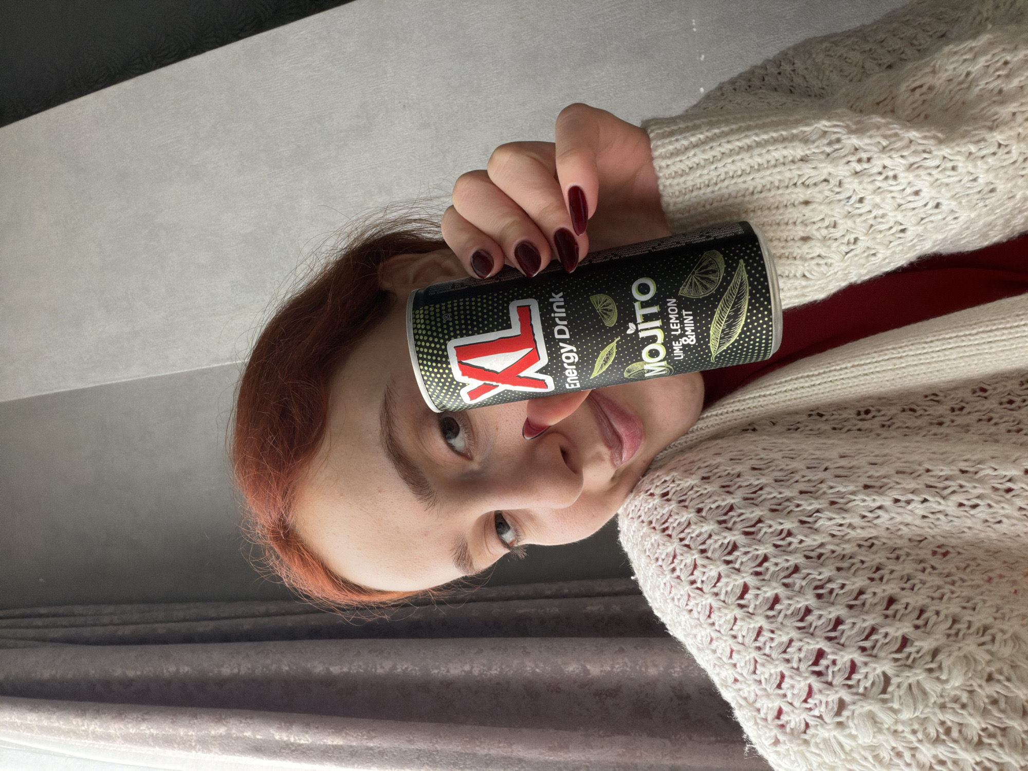 Woman photographed with energy drink in Tbilisi apartment