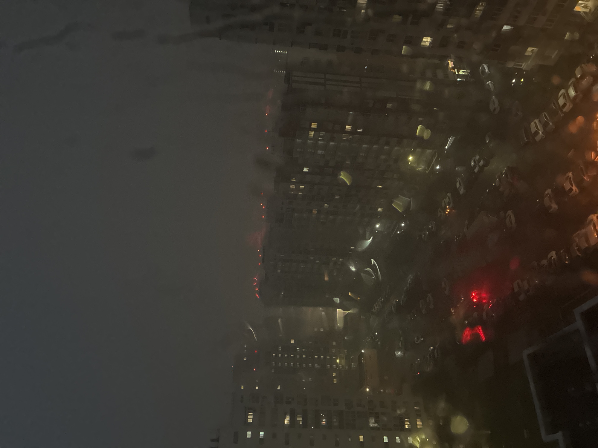 Rainy night view through a window in Orenburg