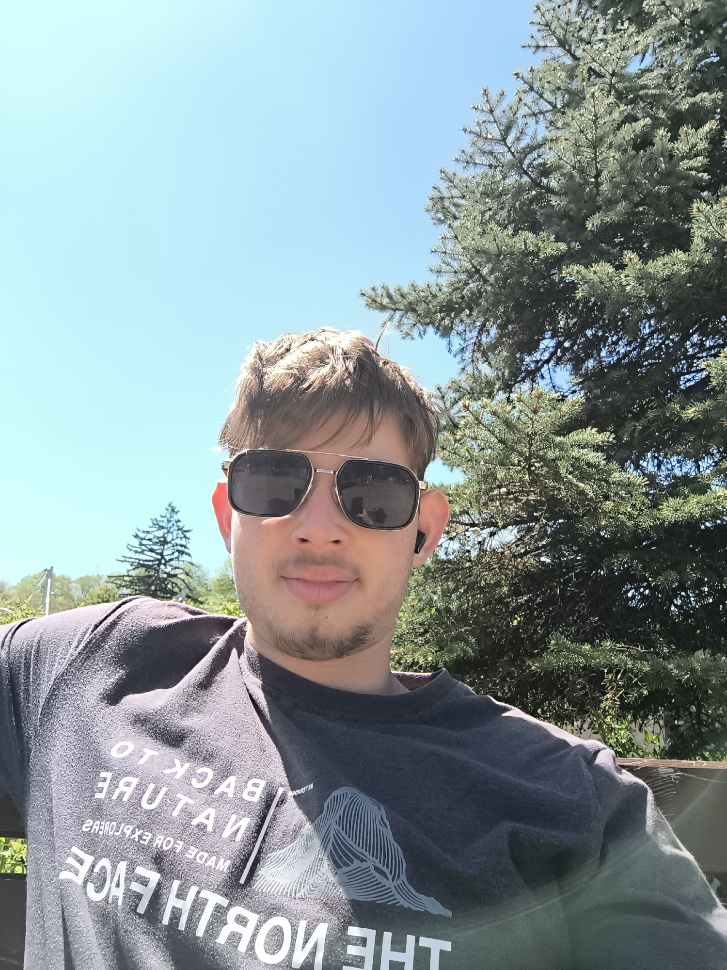 Man takes selfies on park bench in Sofia