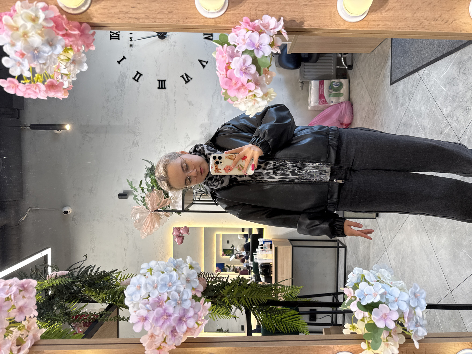 Woman takes selfie at decorated mirror in Saint Petersburg