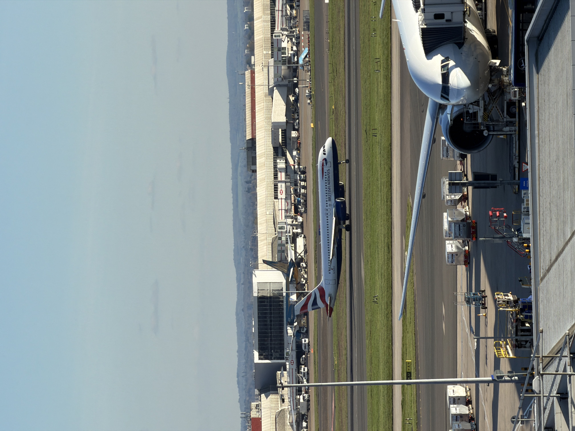 Aerial view captures Heathrow Airport operations under clear skies