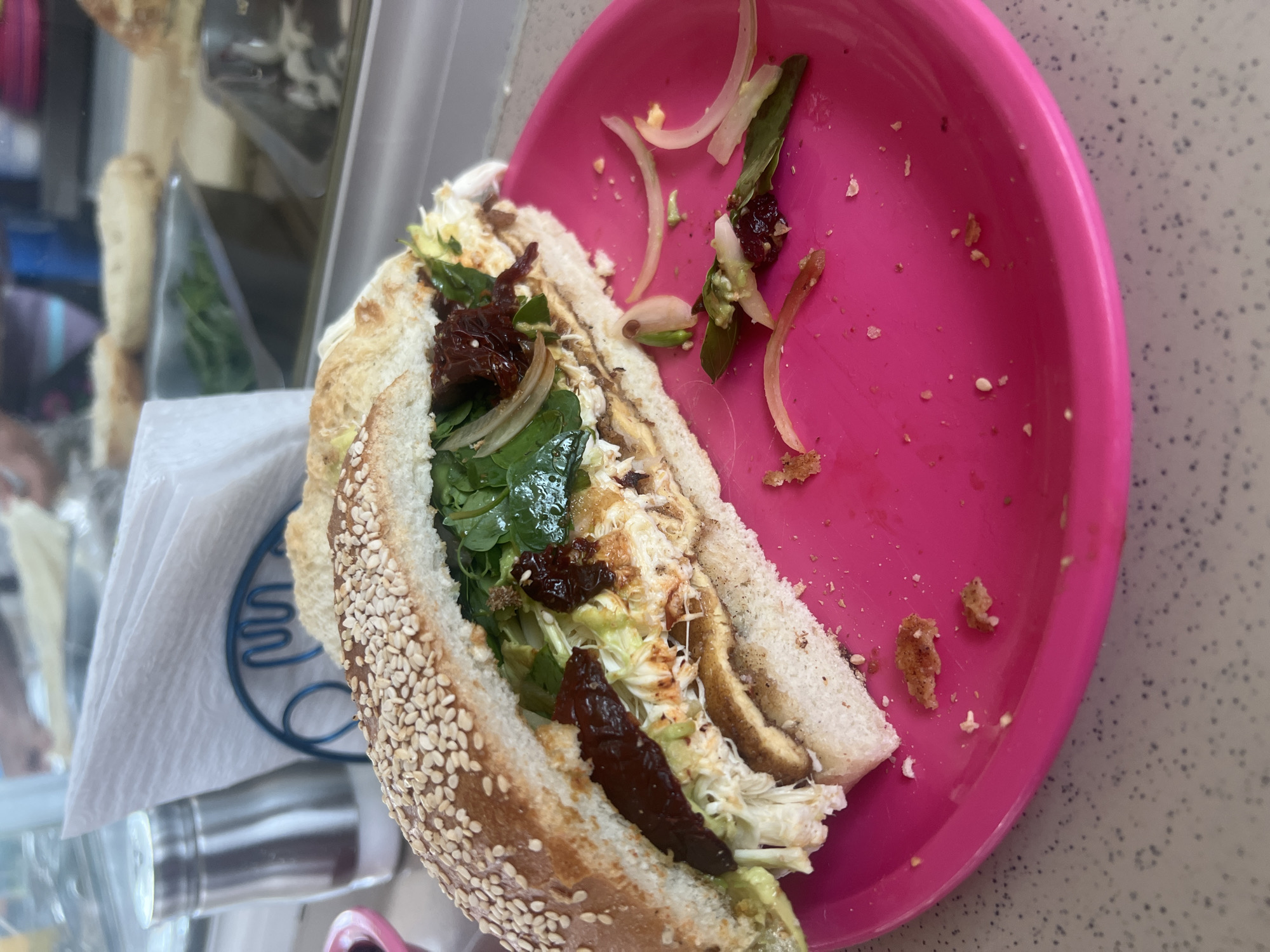 Partially eaten vegetable sandwich documented in Puebla, Mexico