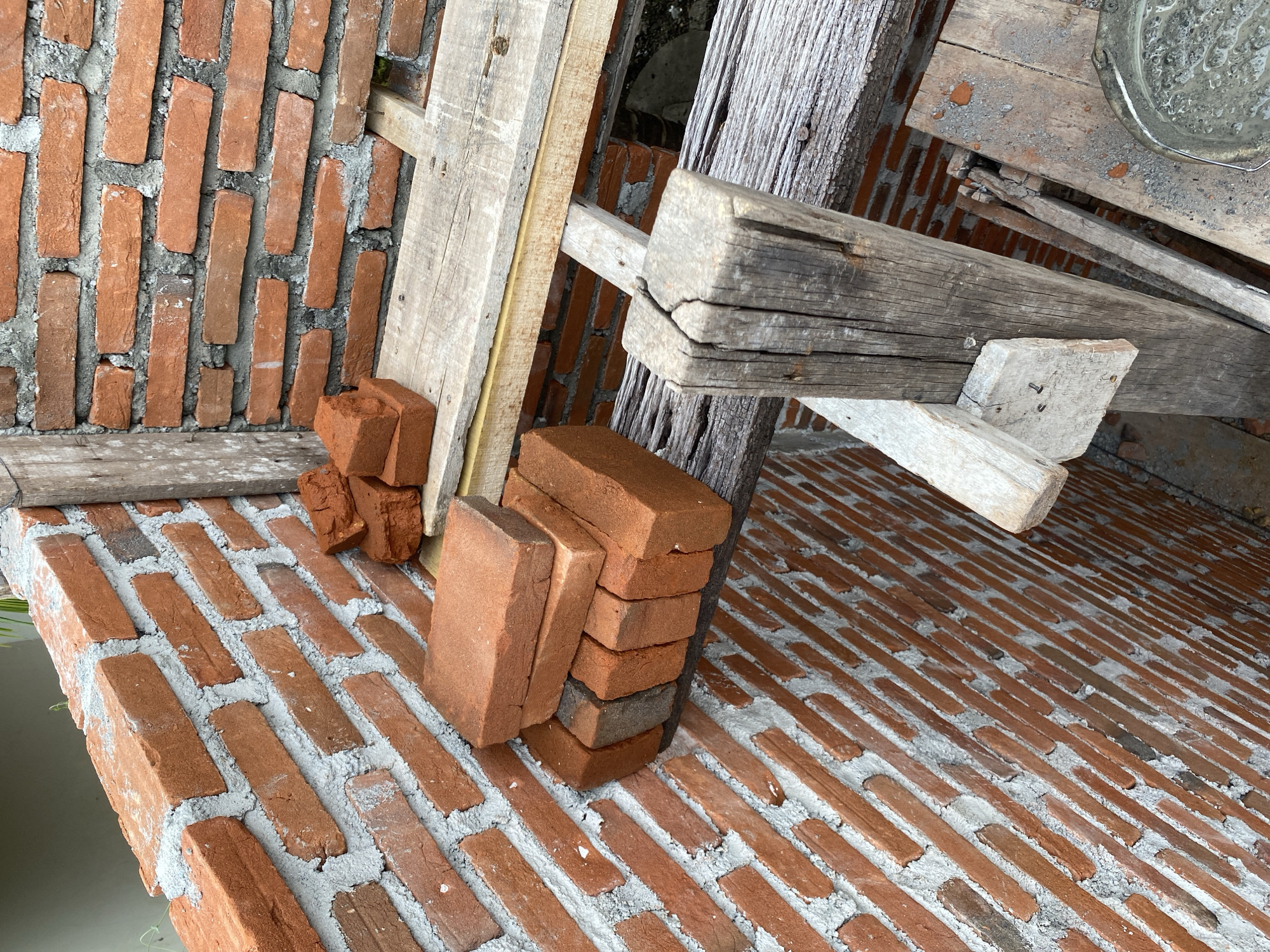 Brick wall construction underway at a tropical residential site