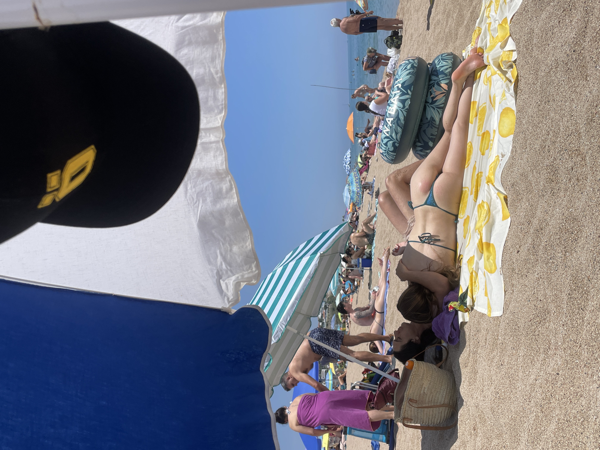 Busy summer beach day captured in Mataró, Spain