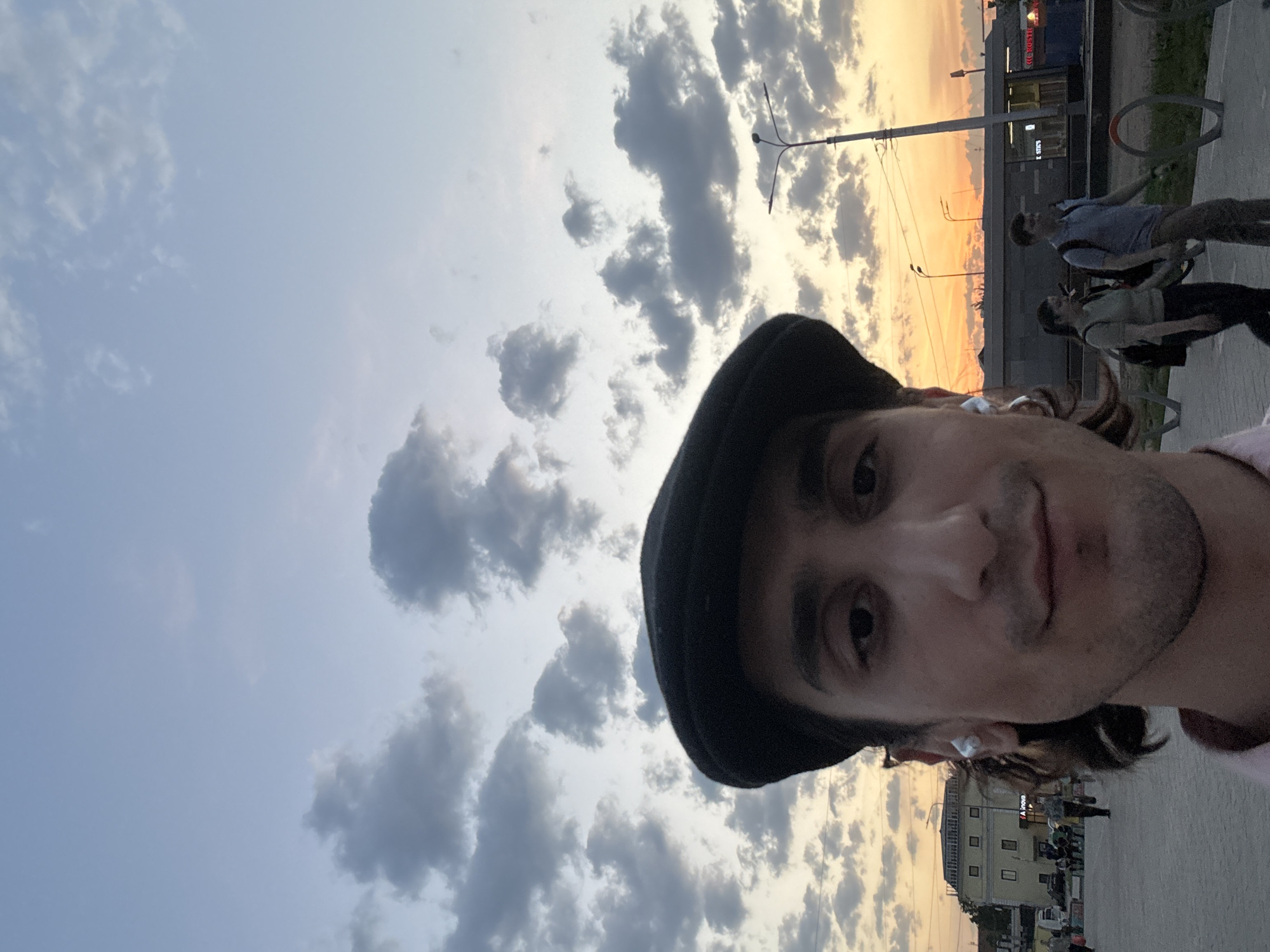 Moscow resident documents cloudy sunset with crescent moon visible