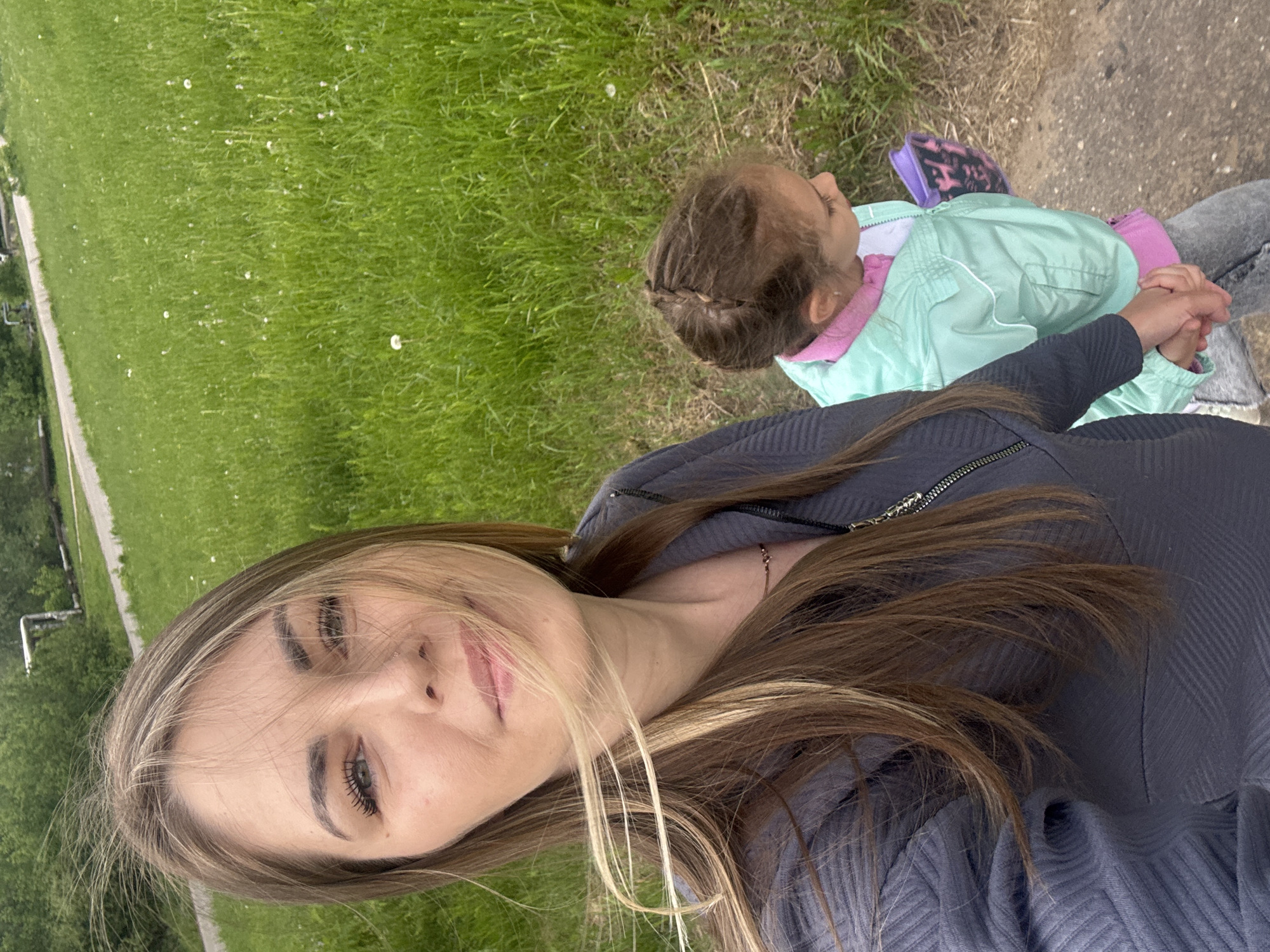 Mother and child enjoy outdoor moment before approaching storm
