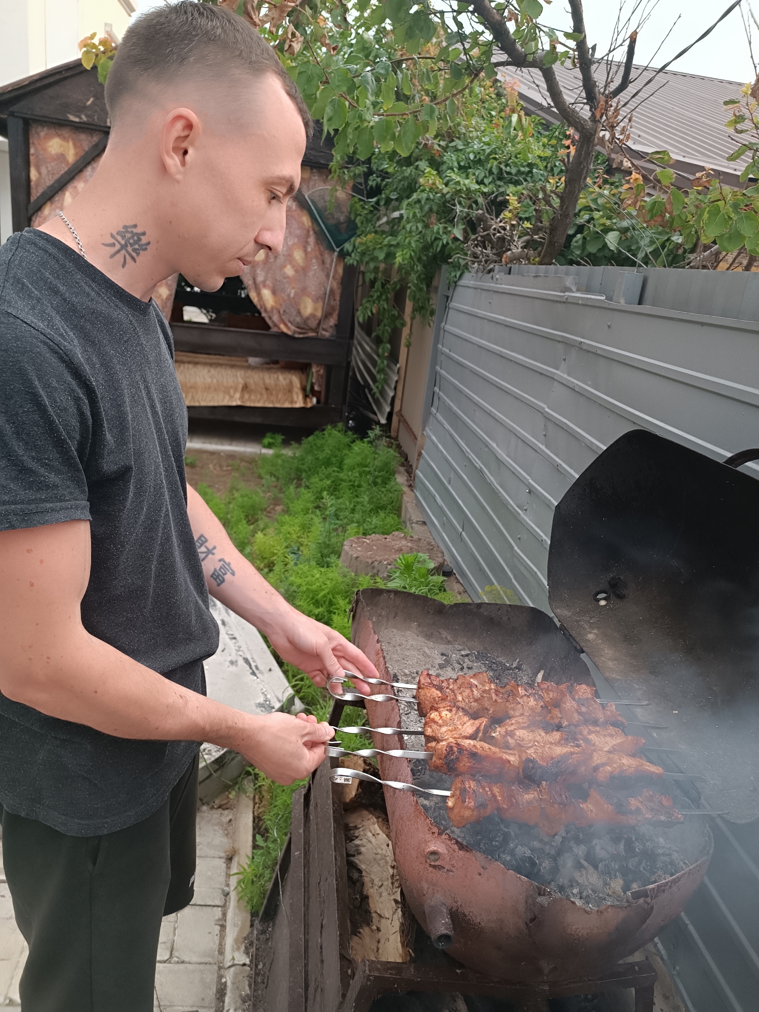 Backyard BBQ winds down into a dramatic waterfront sunset
