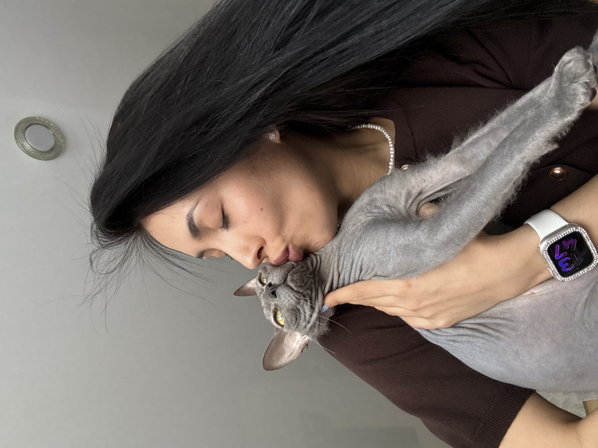 Woman and Sphynx cat captured in intimate home moments