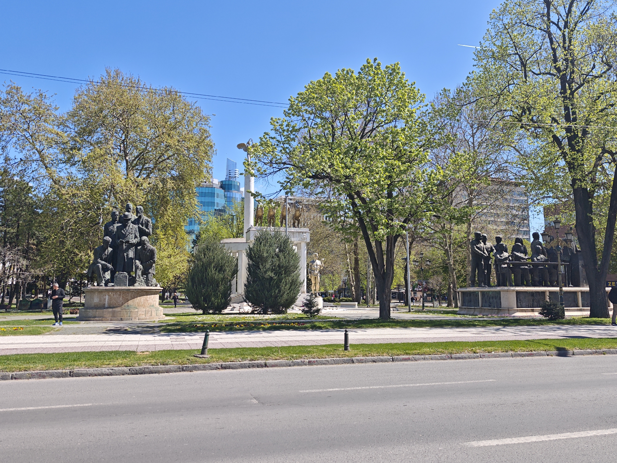 Tourist documents historic monuments in central Skopje park