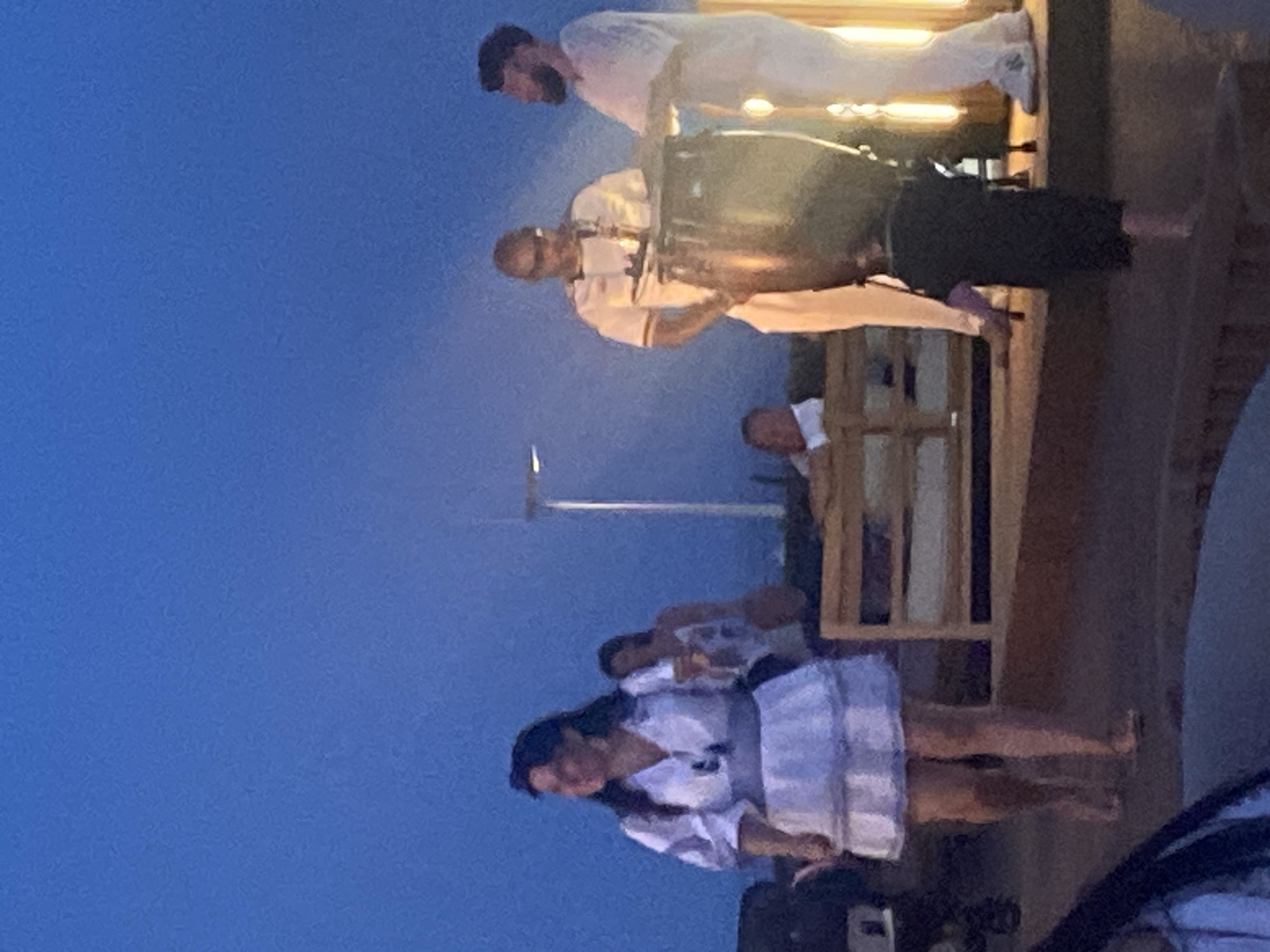 Estepona resort at dusk: coastal paths, live drums, evening crowd