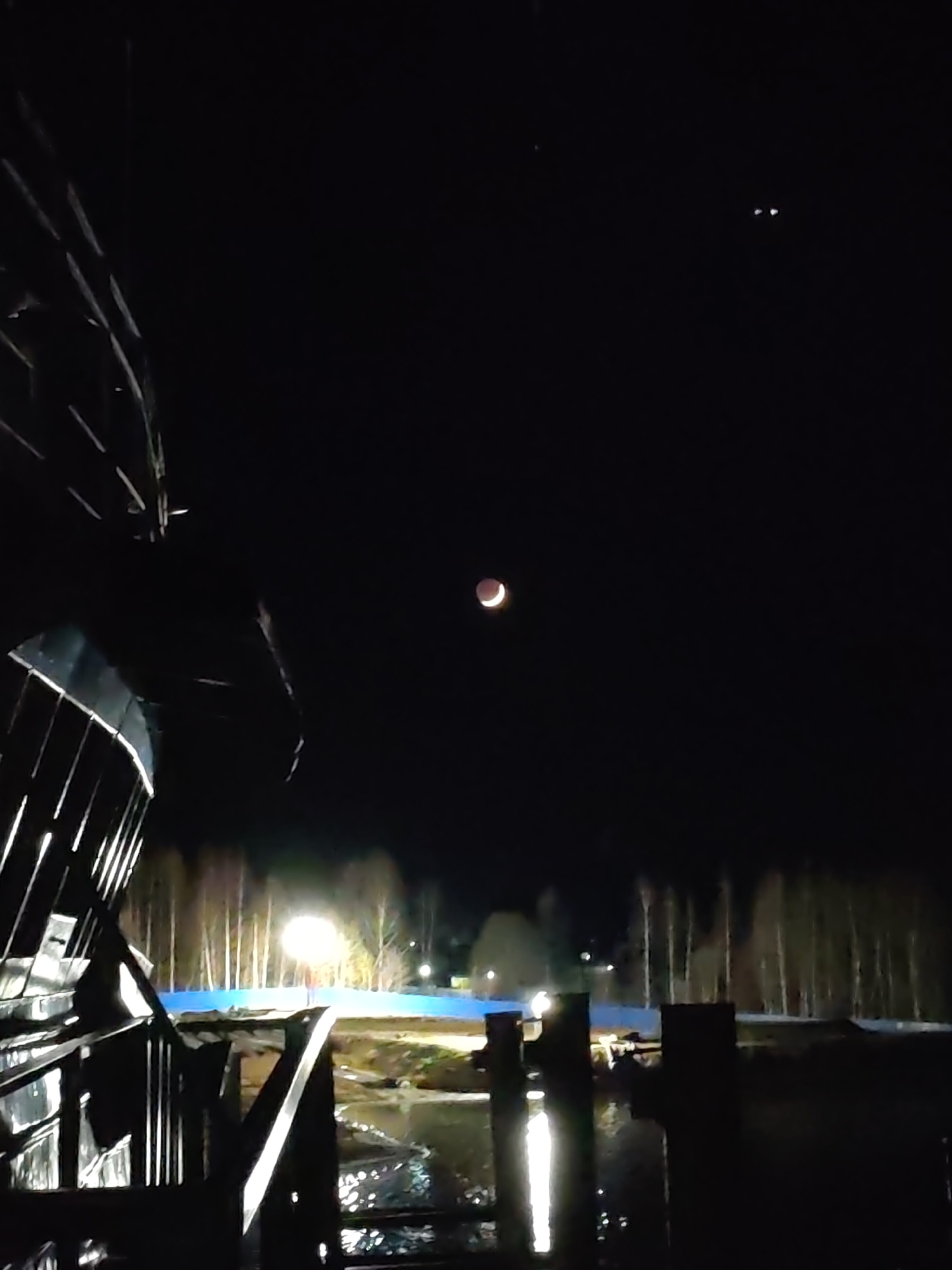 Partial lunar eclipse observed over Bol'shie Mkhi, Russia